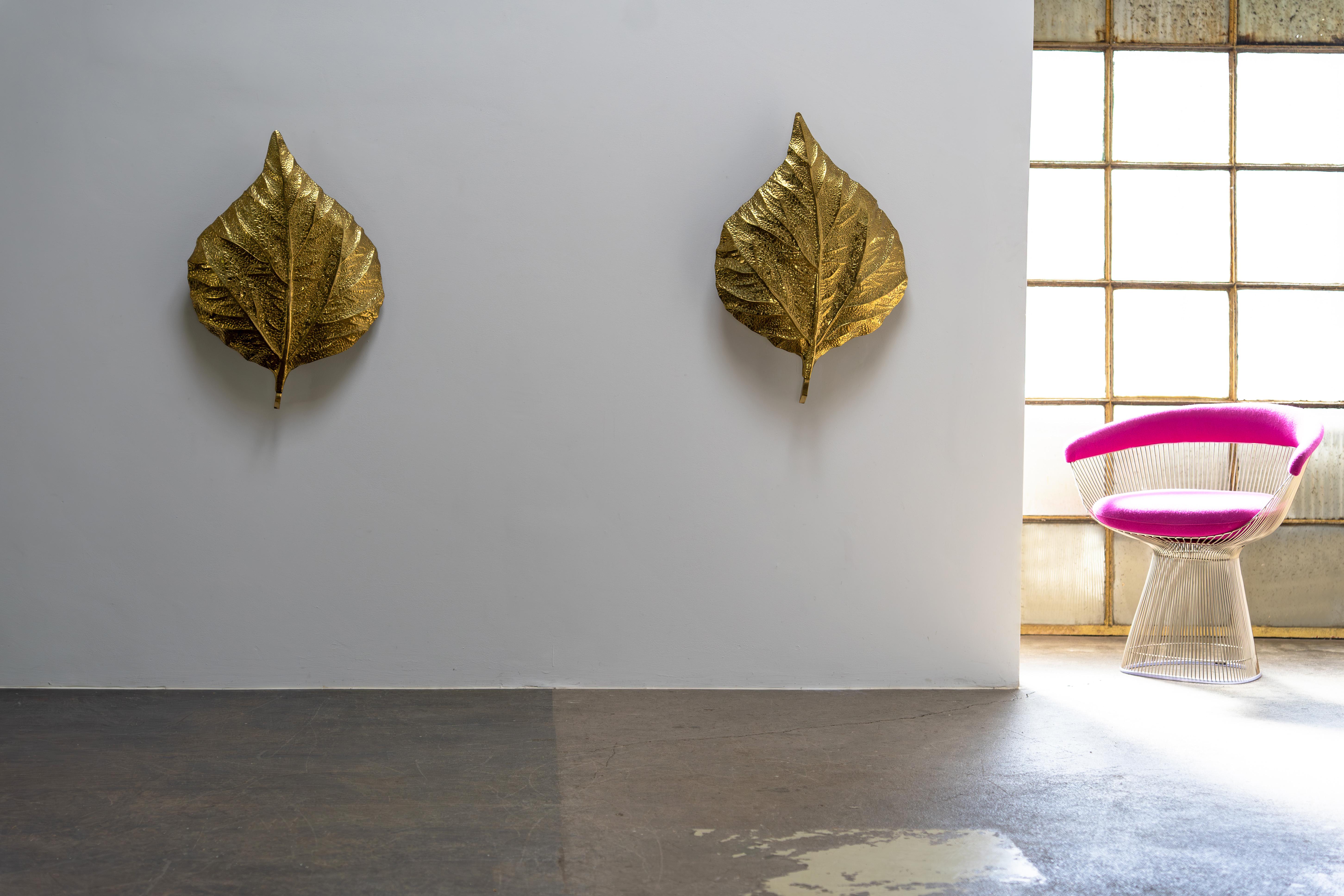 This elegant pair of wall lamps is part of the iconic 