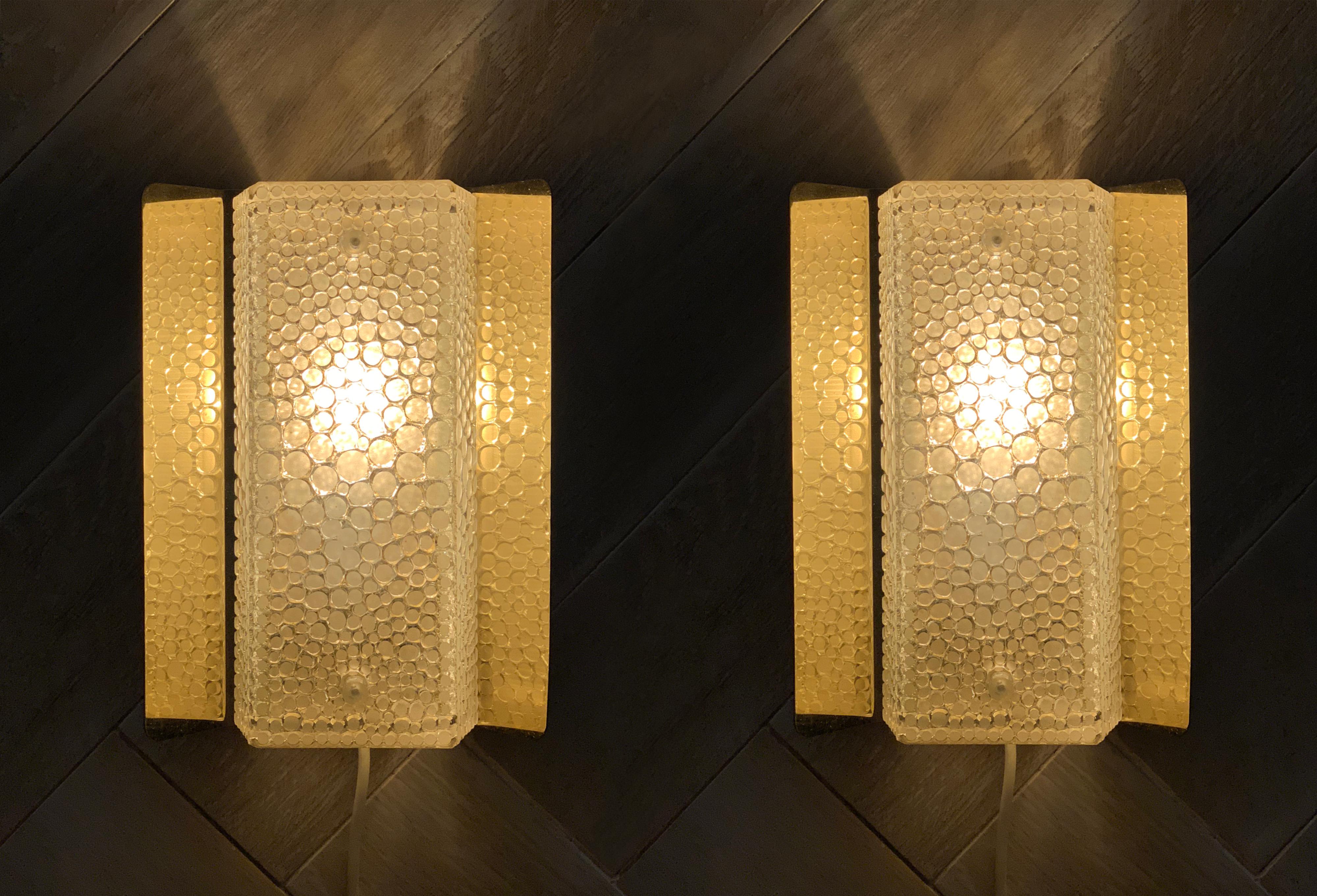Pair of brass wall lights or sconces made in Sweden by Falkenderg in 1970s.