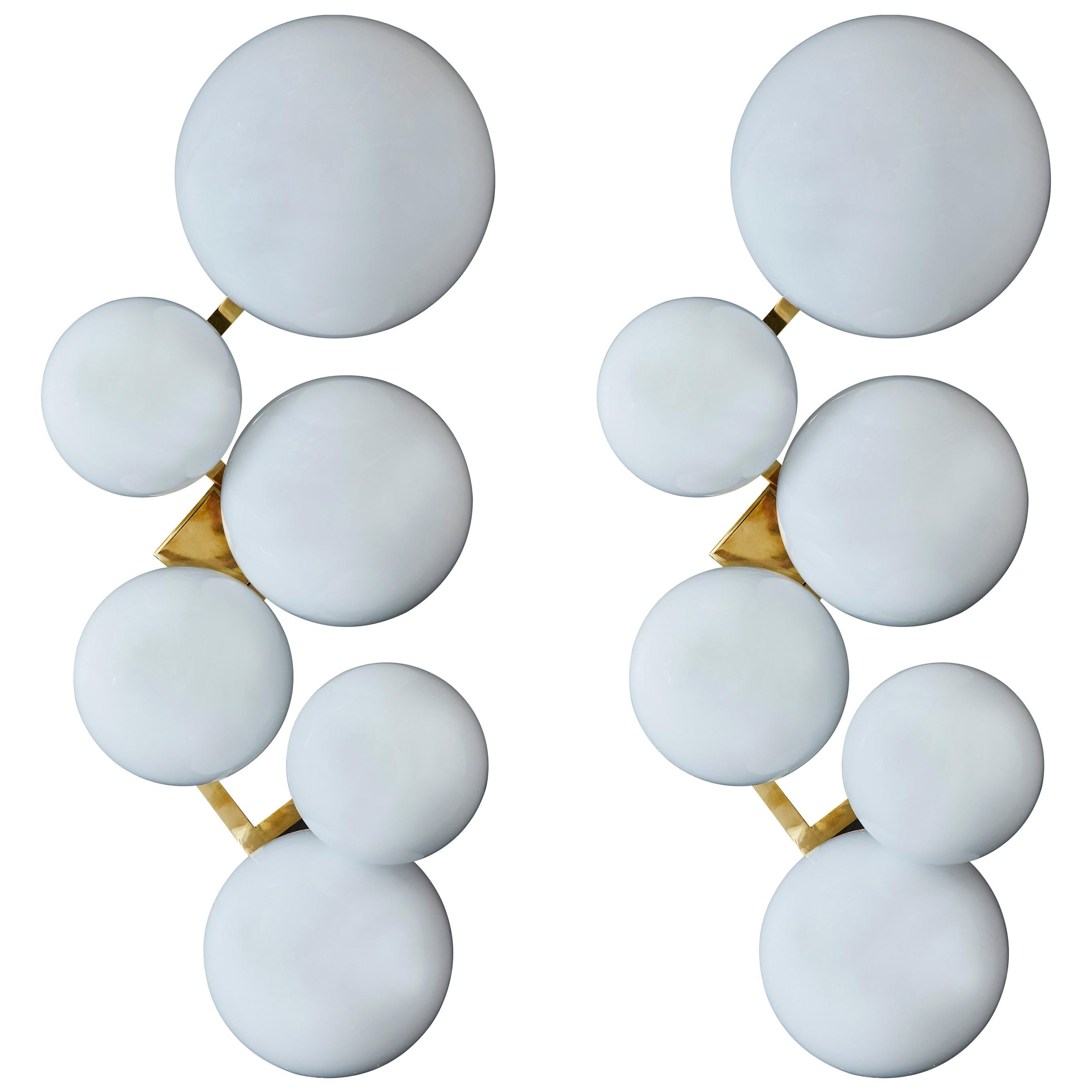 Pair Of Brass Wall Sconces With Different Sized White Glass Globes For Sale At 1stdibs White