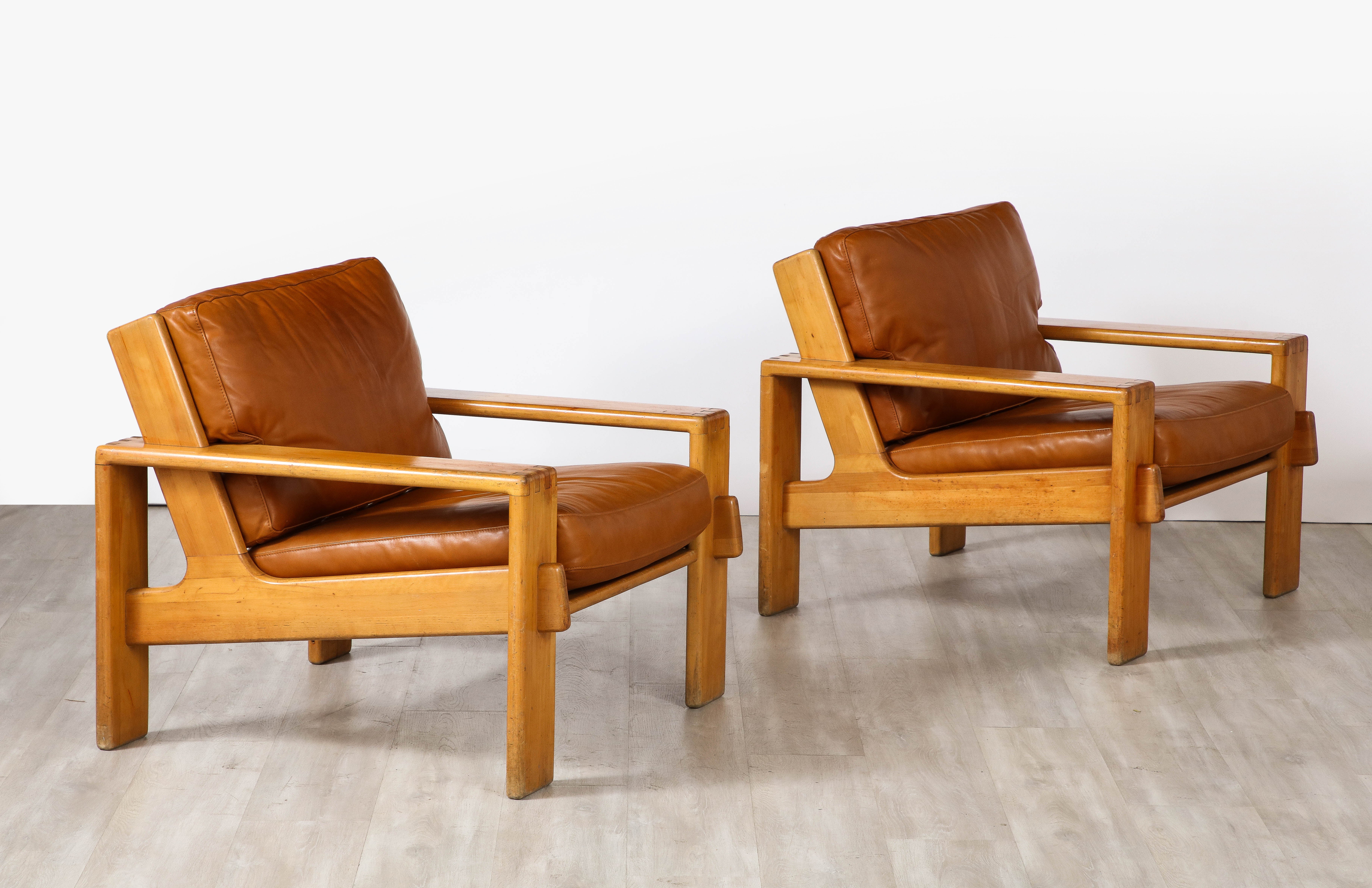 'Bonanza' pair of chairs designed by Esko Pajamies for Asko, Finland, circa 1960.
A pair of highly sculptural 1960's lounge chairs in oak with fantastic angular form. With horizontal wood slat backs, wide arm rests, seats and backs; the seats and