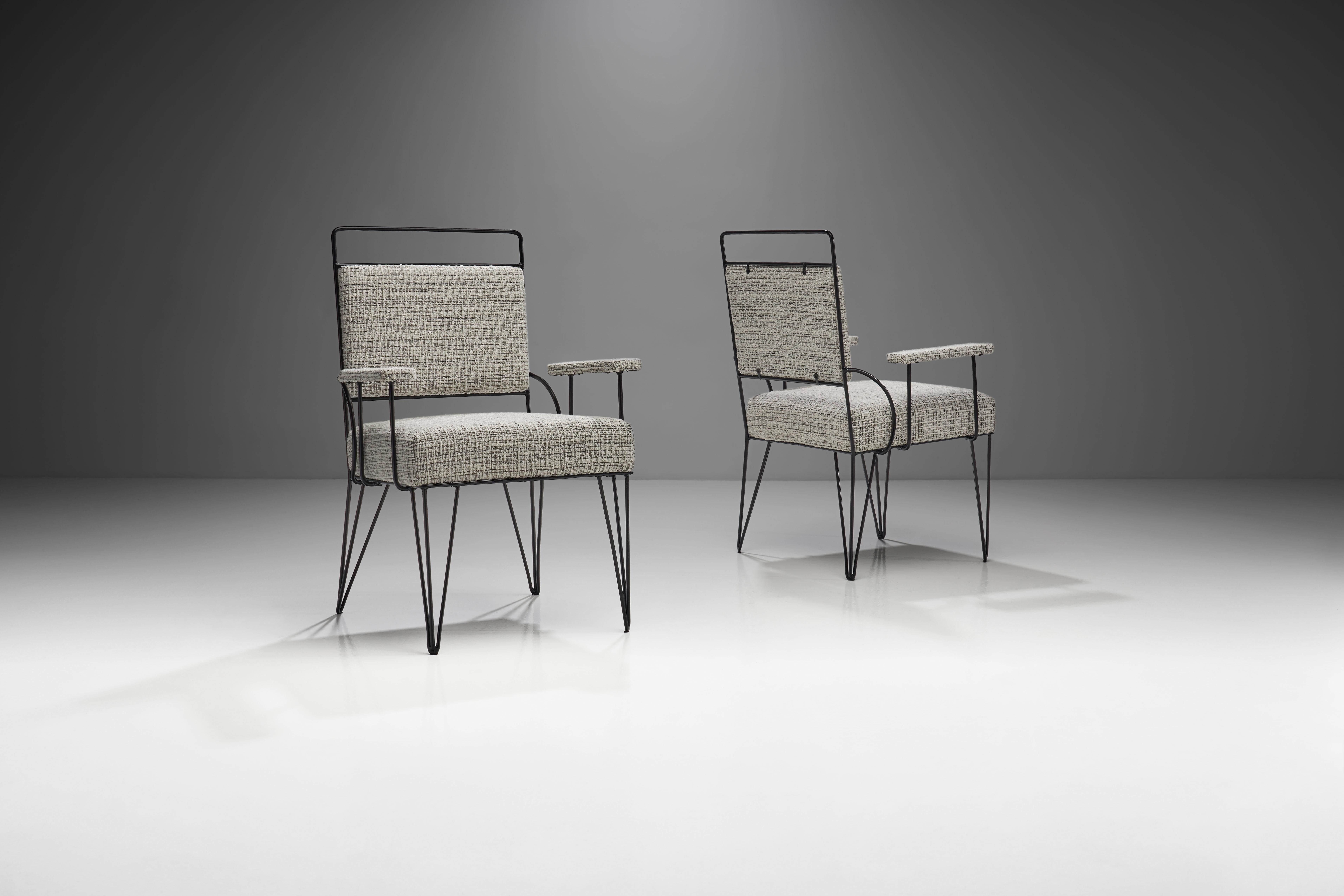 This imposing pair of Brazilian armchairs in iron and fabric is a visually stunning representation of Brazilian Modern design. The well thought out minimalism of these armchairs is honest, elegant and comfortable.

The pair is defined by geometric
