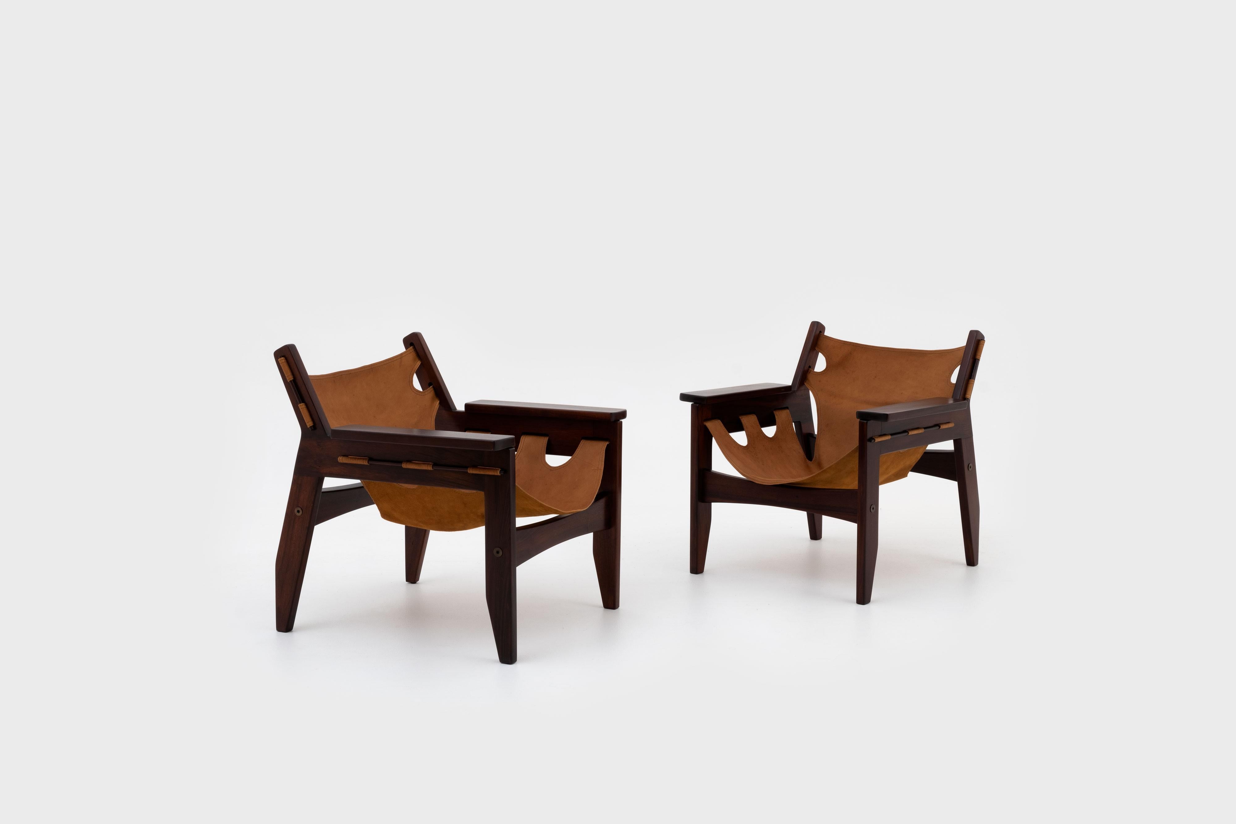 Beautiful pair of 'Kilin' lounge chairs by Sergio Rodrigues for Oca, Brazil 1973.
Distinctive design out of solid Rosewood and natural Ocre colored leather with a beautiful patina. Very elegant and comfortable armchairs in excellent condition.
 