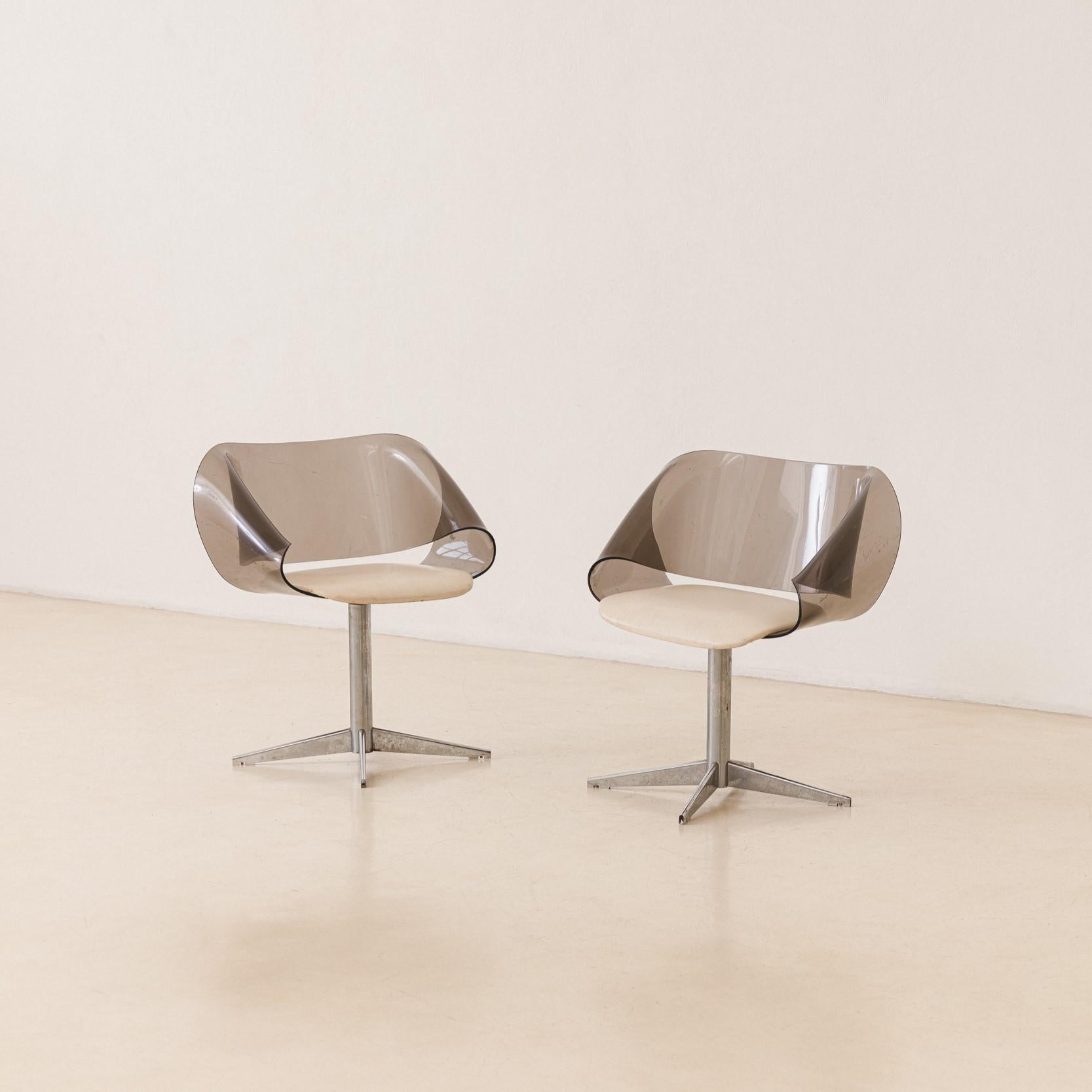 This beautiful pair of armchairs with slatted seats and backs was manufactured in the 1960s.

Pieces are made of solid Brazilian Rosewood. The armchairs have a rectangular design with the backs composed of vertical slats and veins with stunning