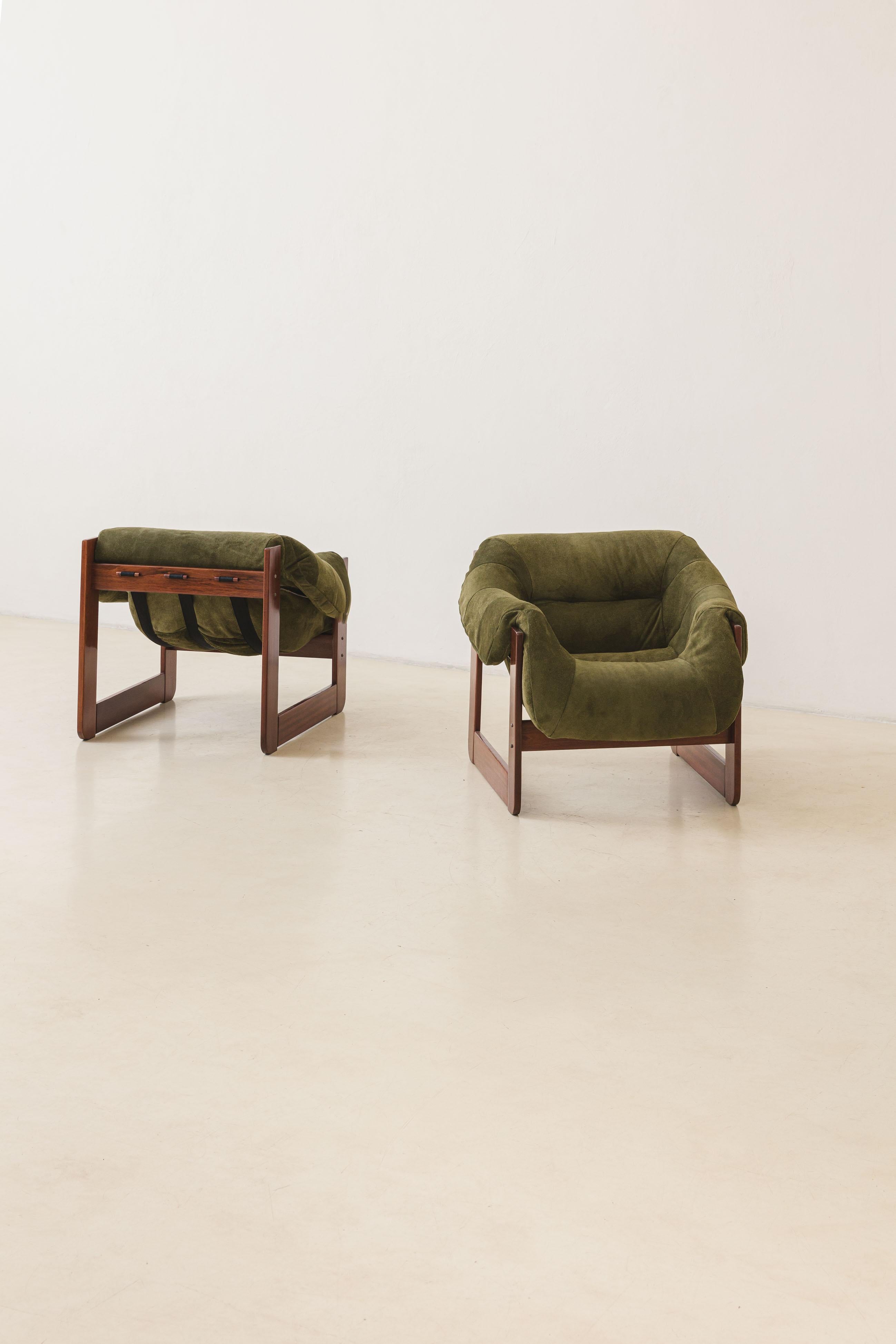 In his designs, Percival Lafer sought ergonomy and comfort. This pair of MP-97 lounge chairs by Percival Lafer comprises a solid Cedar wood structure with a single piece of a loose foam seat. Its unique design and construction make this an authentic