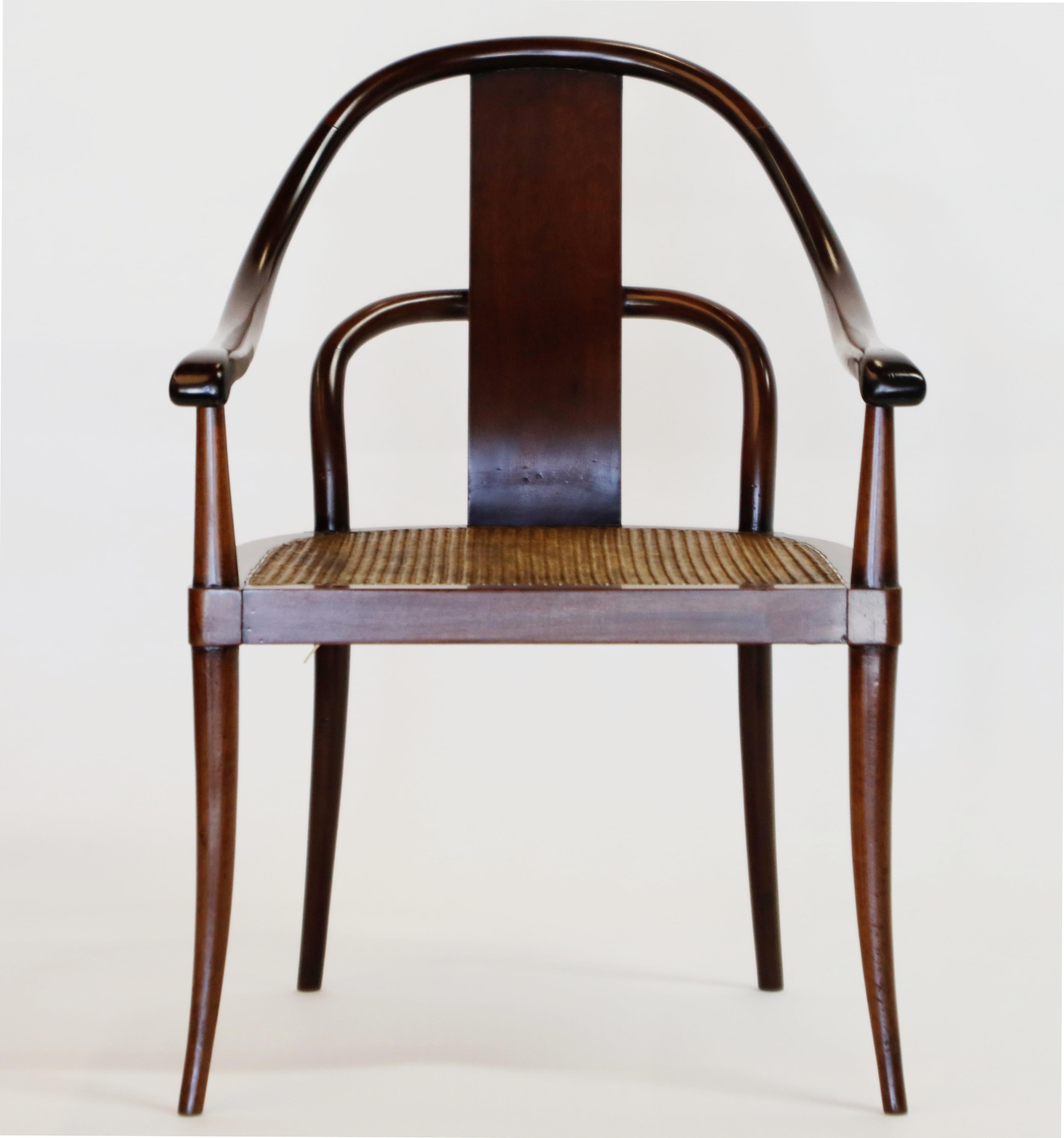 An incredibly gorgeous pair of Thonet style bentwood chairs crafted from Brazilian rosewood and cane. This pair of Art Deco chairs, made in Brazil circa 1940s, are simply stunning - such wild curves and shape. The seat back of Brazilian Rosewood is