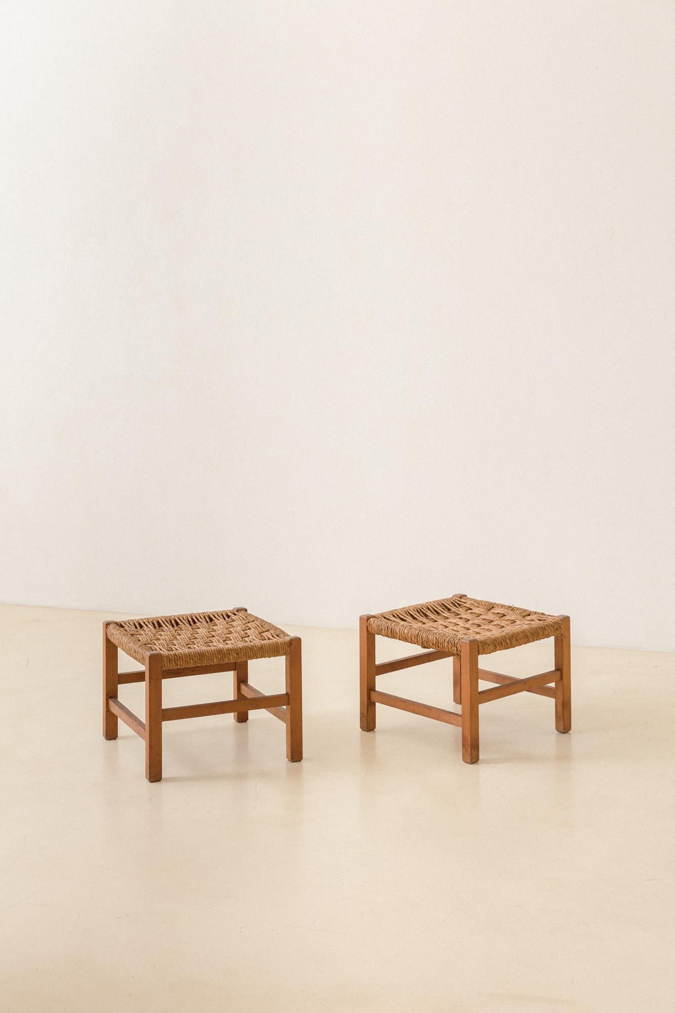 This pair of stools produced in the 1960s is composed of a solid wood rectangular structure with hand-woven taboa straw seats. The pieces still have the authorship unidentified by our team. 

The stool is one of the first forms of individual