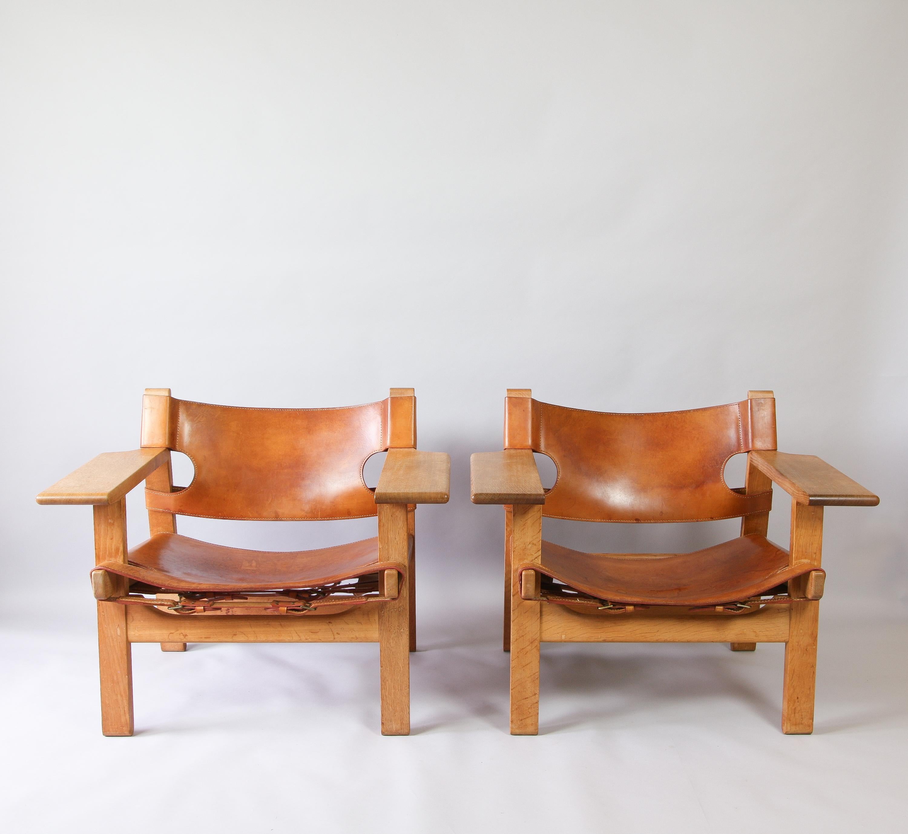 A fabulous pair of 1960s Børge Mogensen Spanish chairs for Fredericia. Designed in 1958, constructed in cognac saddle leather and solid oak. Great vintage condition and patina.