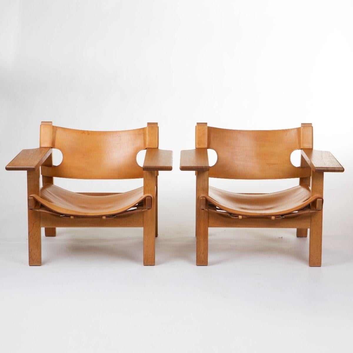Børge Mogensen (Danish 1914-1772)
A pair of iconic “Spanish Chairs” (BM 2226), designed by Børge Mogensen in 1958 and produced by Fredericia Stolefabrik.
Crafted in solid oak with robust saddle leather, tightened with adjustable leather