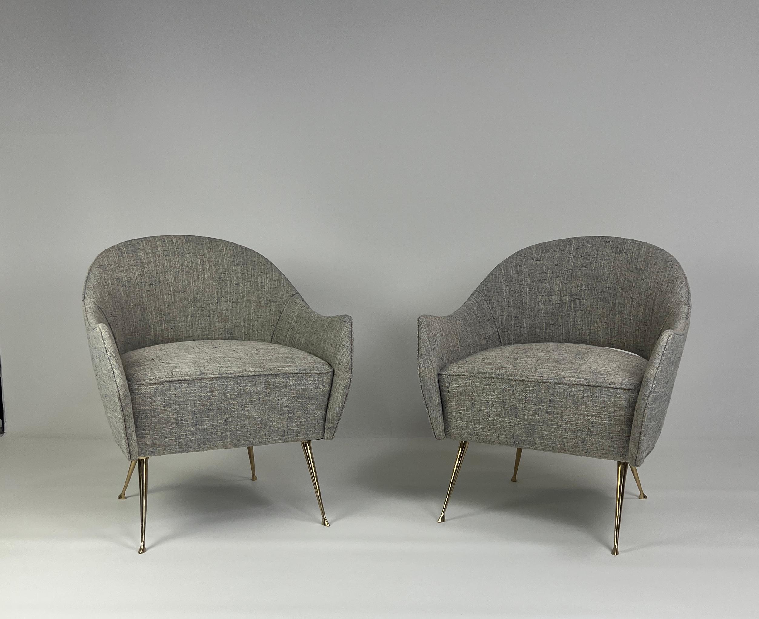 These elegant chairs have cast brass legs and a distinctive curved back. The chairs are very comfortable, perfect in size and are ideal as small-scale side chairs. The beauty of the tapered brass legs with their graceful feet are sure to add that
