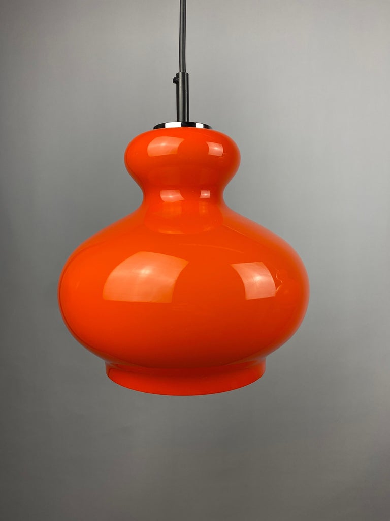 Pair of bright orange glass pendant light by Peill and Putzler 1960 For