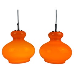 Pair of bright orange glass pendant light by Peill and Putzler 1960