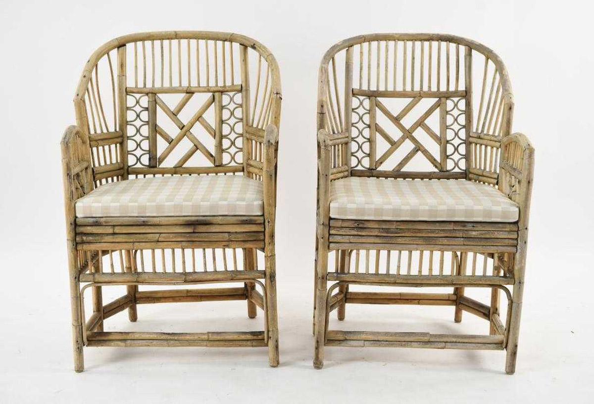 The stylish pair of bleached bamboo chairs have plaid cushions over woven raffia seats. These add style to either indoor or outdoor settings.  Bamboo shows weathering from previous outdoor use.

Keywords: Tortoise or bamboo chairs, rattan, wicker,