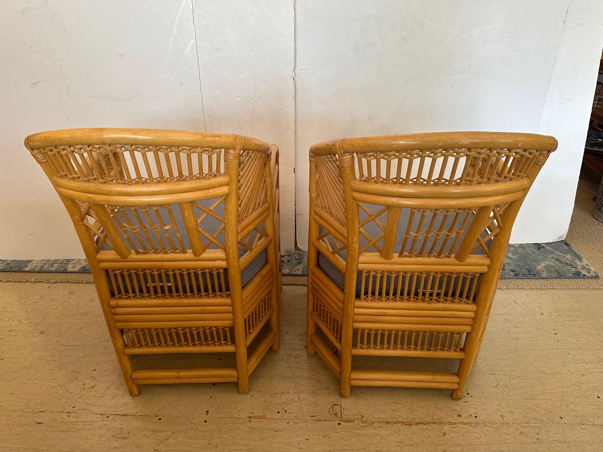 Classic pair of Chinese Chippendale style bamboo and rattan armchairs having custom blue seat cushions. Handsome front and back.
arm height 27
seat depth 21