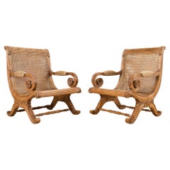 Pair of British Colonial Style Carved Caned Plantation Chairs