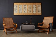 Pair of British Colonial Teak and Cane Plantation Chairs