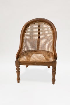 Pair of British Colonial Teak Caned Bergeres