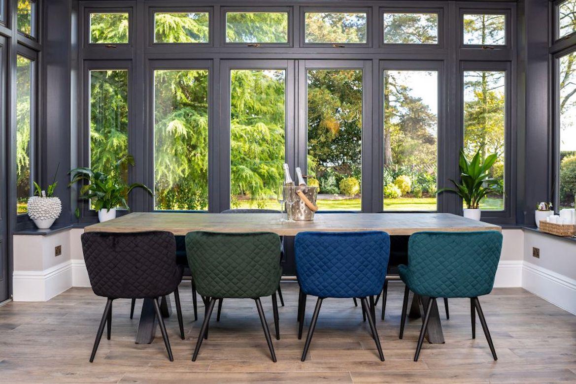 A stunning pair of Bronte velvet dining chairs, 20th century.

The Bronte velvet dining chairs are a modern take on the Classic tub style chair. They are available in five beautiful colors, timeless teal, black, pine green, midnight blue and cool