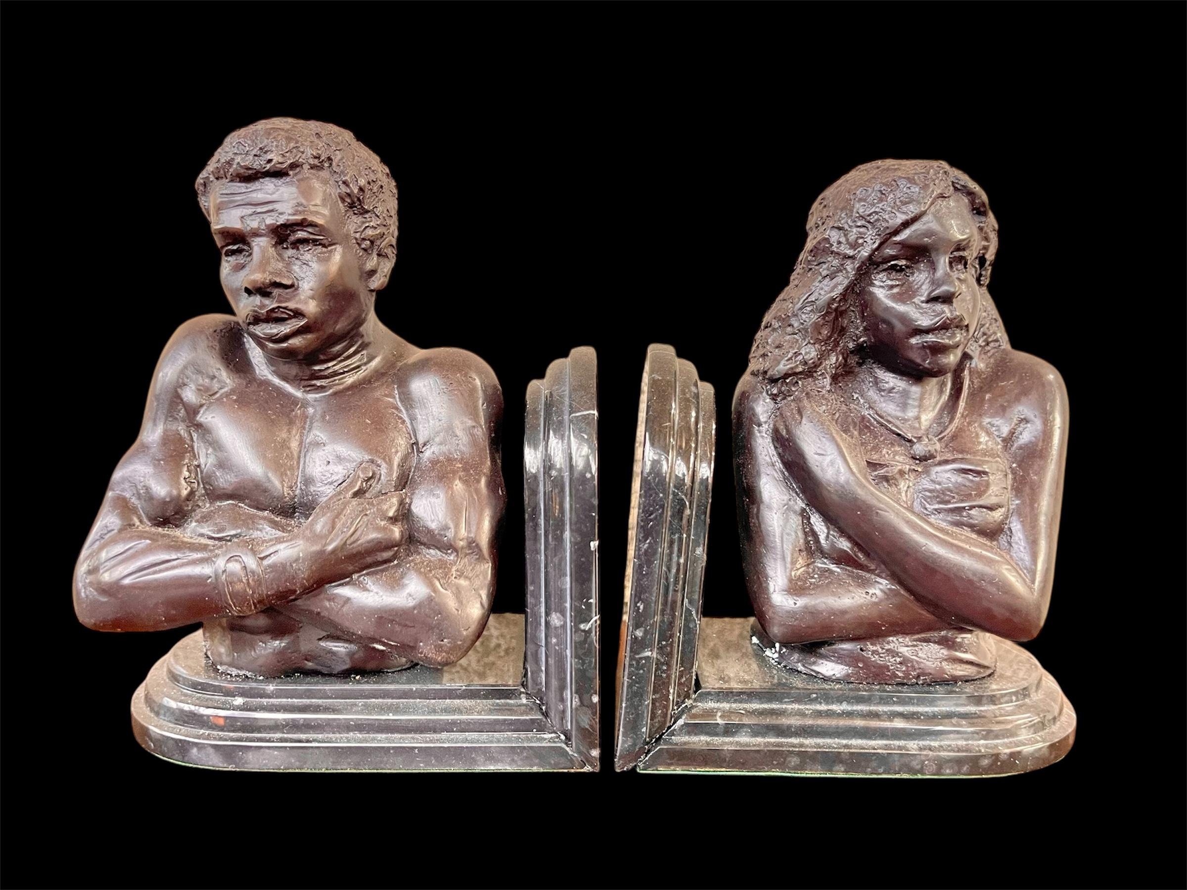 Pair of bronze African male and female figurative bust bookends
