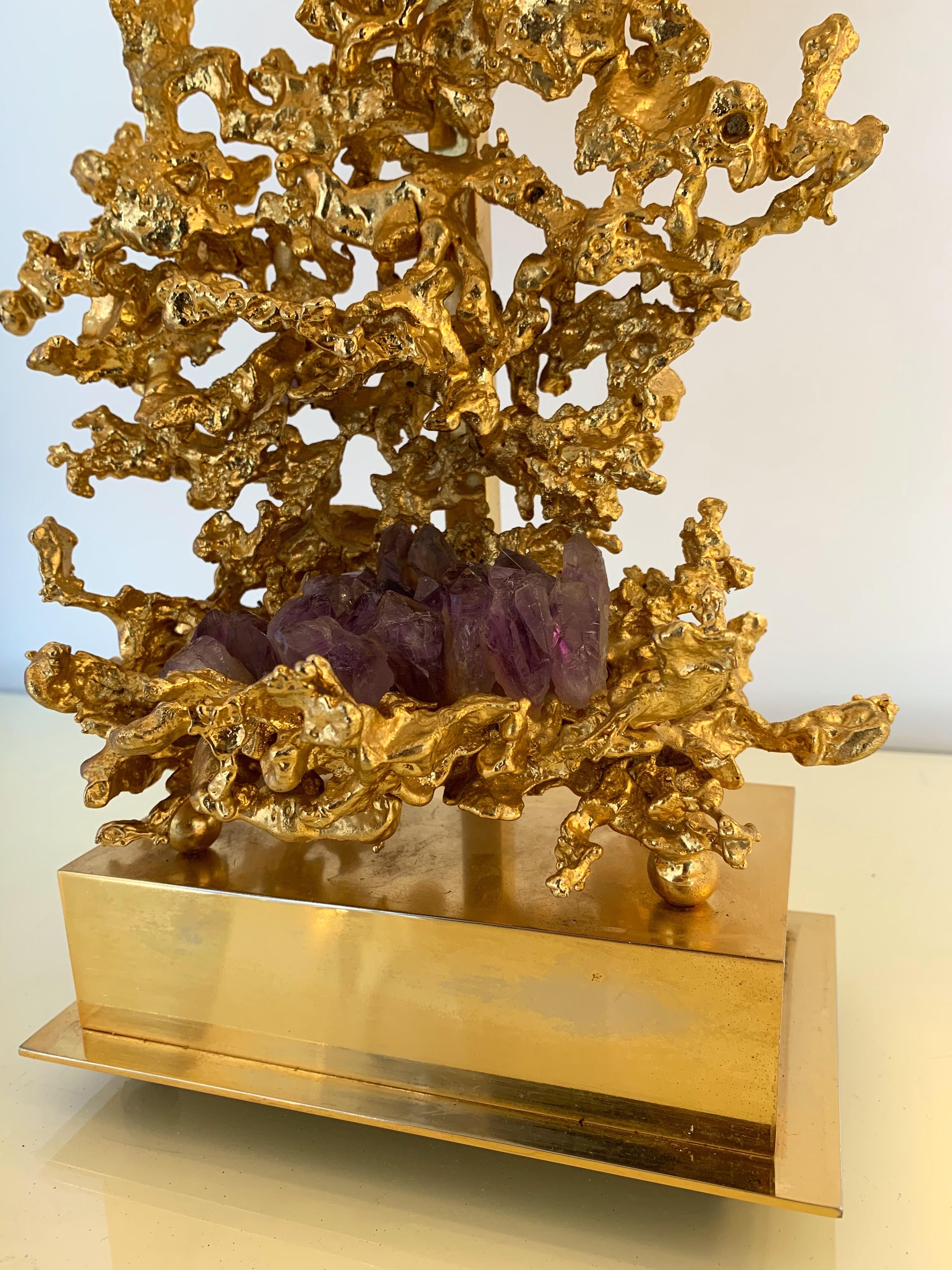 Rare pair of gilt bronze and Amethyst stone lamps by the artist Claude Victor Boeltz. Unusual technic called by the artist Explosed bronze. Sign ingrave Boeltz ¨Paris. Original shades from the 1970s. Height top finial 36cms. Famous design like
