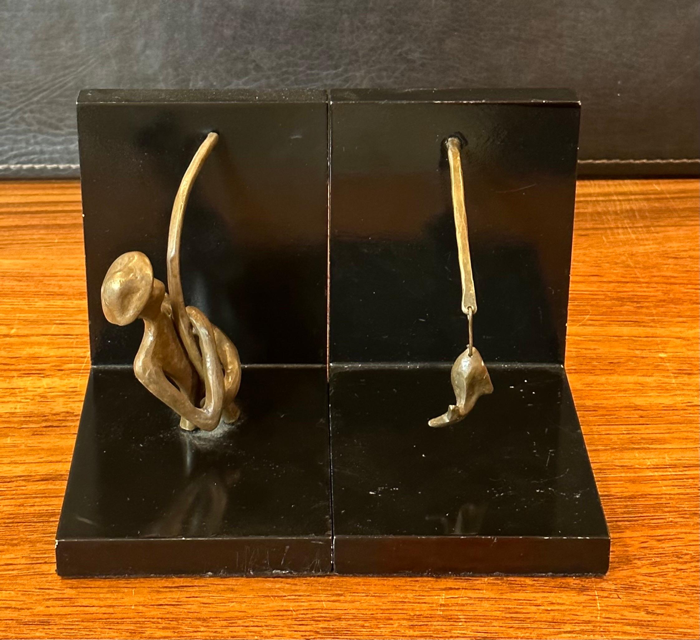 20th Century Pair of Bronze and Black Lacquer Fisherman Bookends For Sale