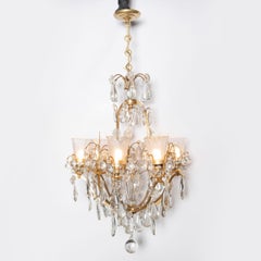 Pair of bronze and crystal chandeliers. France, circa 1940.