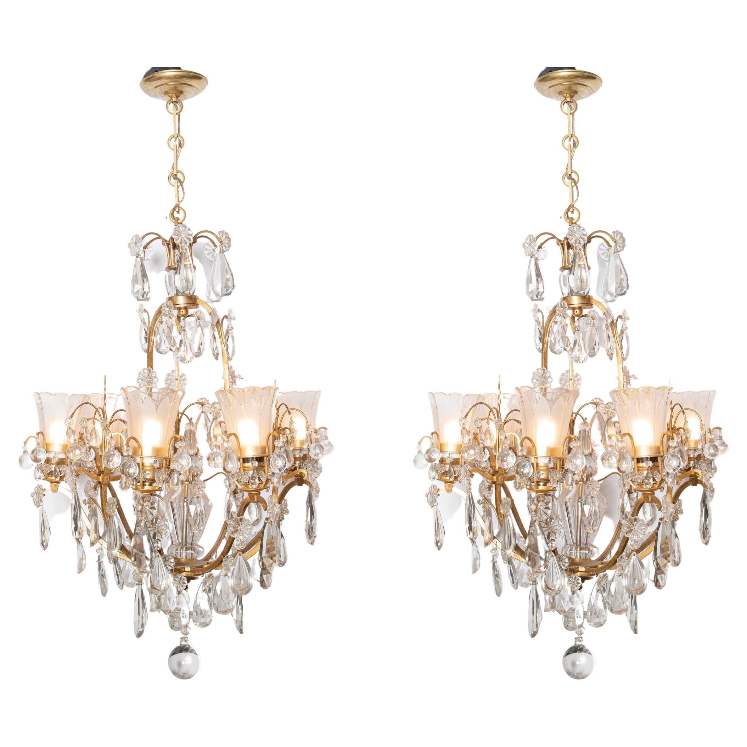 Pair of bronze and crystal chandeliers. France, circa 1940. For Sale