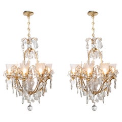Vintage Pair of bronze and crystal chandeliers. France, circa 1940.