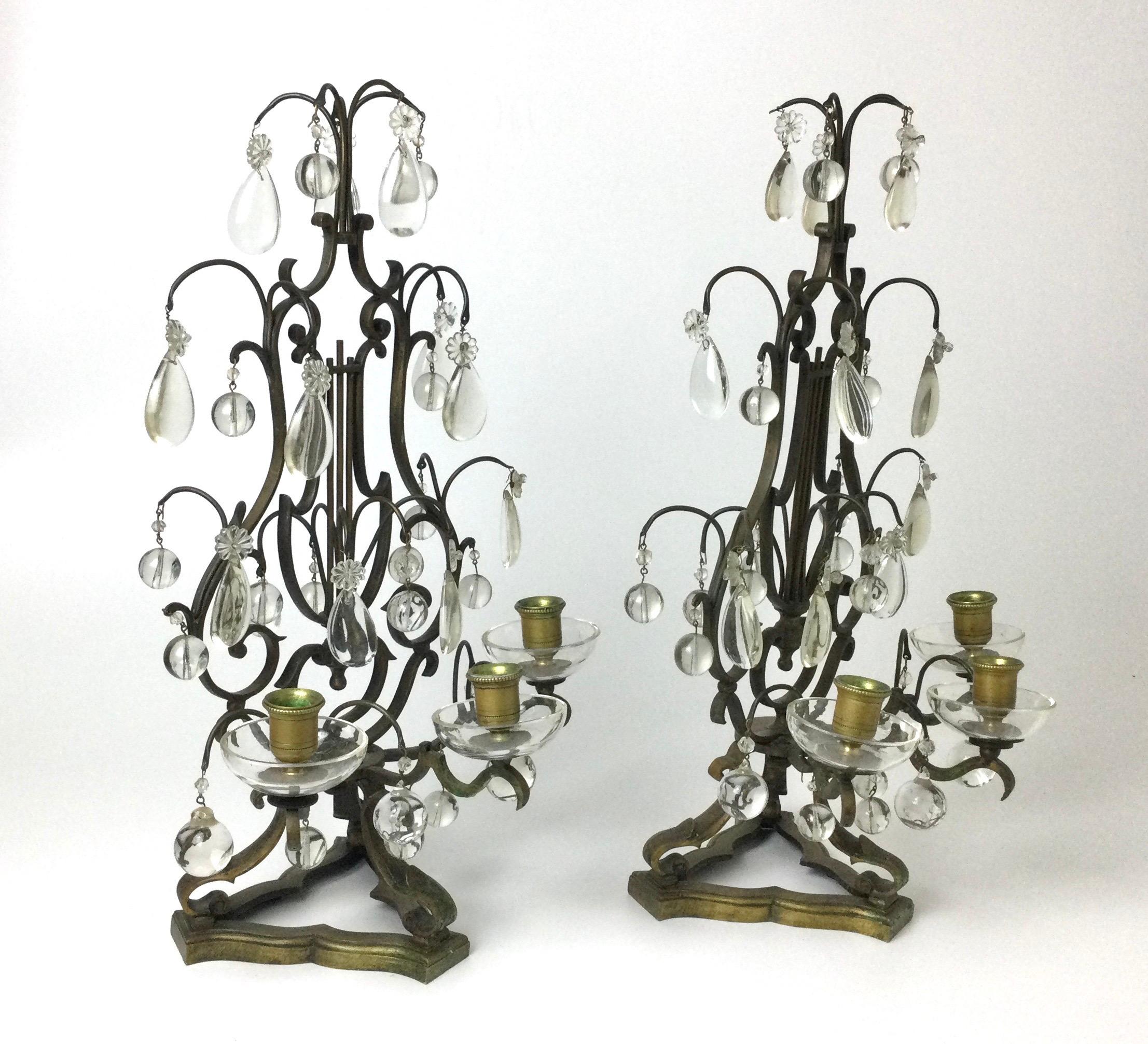 Wonderful pair of three light candleholder candelabras. Bronze lyre form full of crystals. There are 3 open holes on the bottom of each to possibly? Hang more crystals from. Plucked from a large mantel in Norther NJ several years ago. Measures: 11