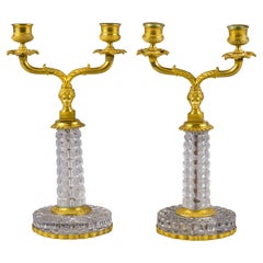 Pareja de candelabros de dos luces de bronce y cristal, hacia 1860