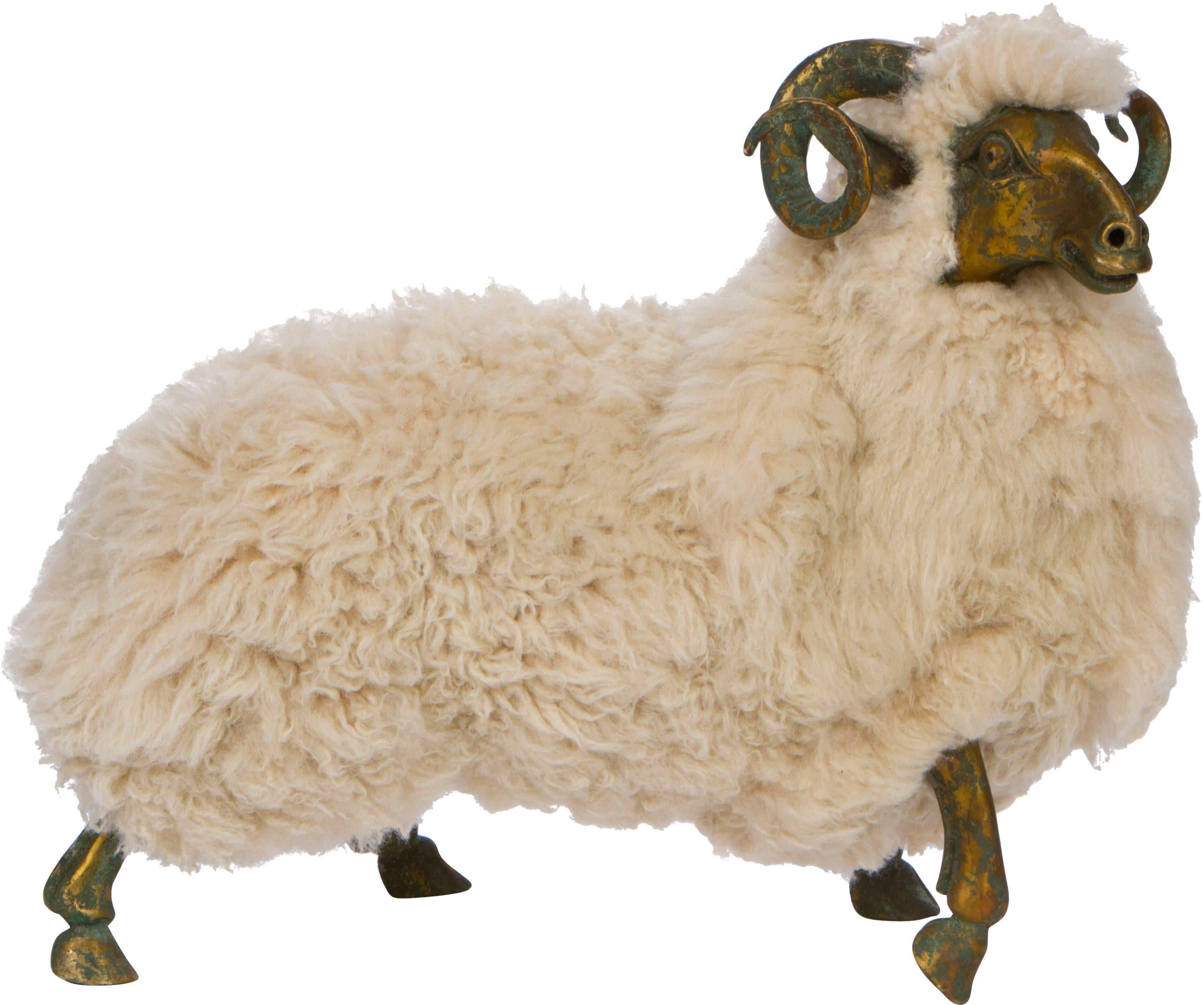 Whimsical, yet sophisticated, pair of sheep likely French, 20th century. Constructed of bronze and wool fur, the sheep are in excellent condition.
Third identical sheep is available. 