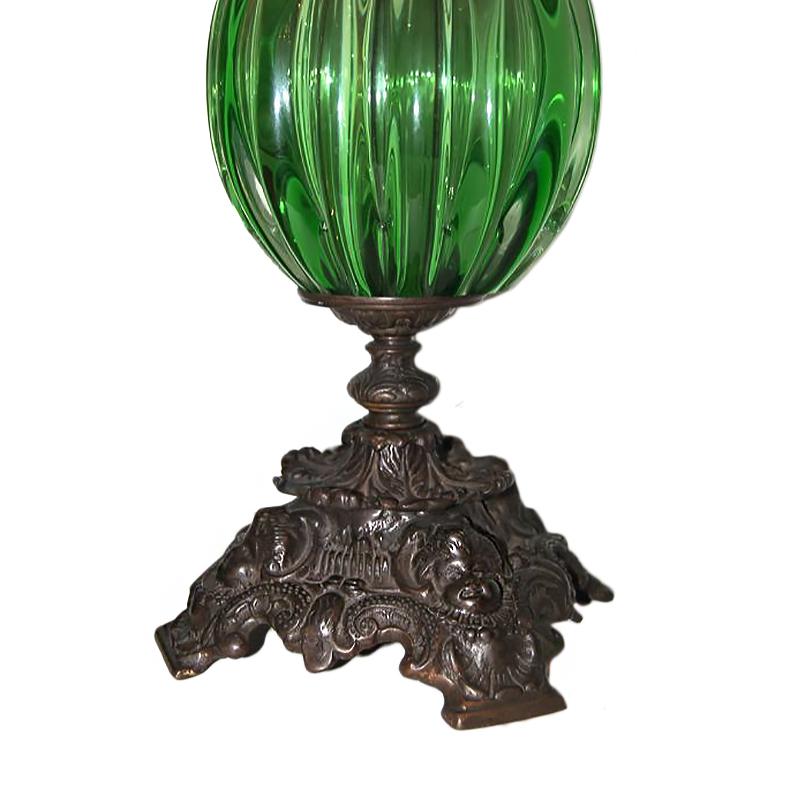 Pair of circa 1920s Italian green Murano glass table lamps with patinated bronze base and body.

Measurements:
Height of body / top of handle 25