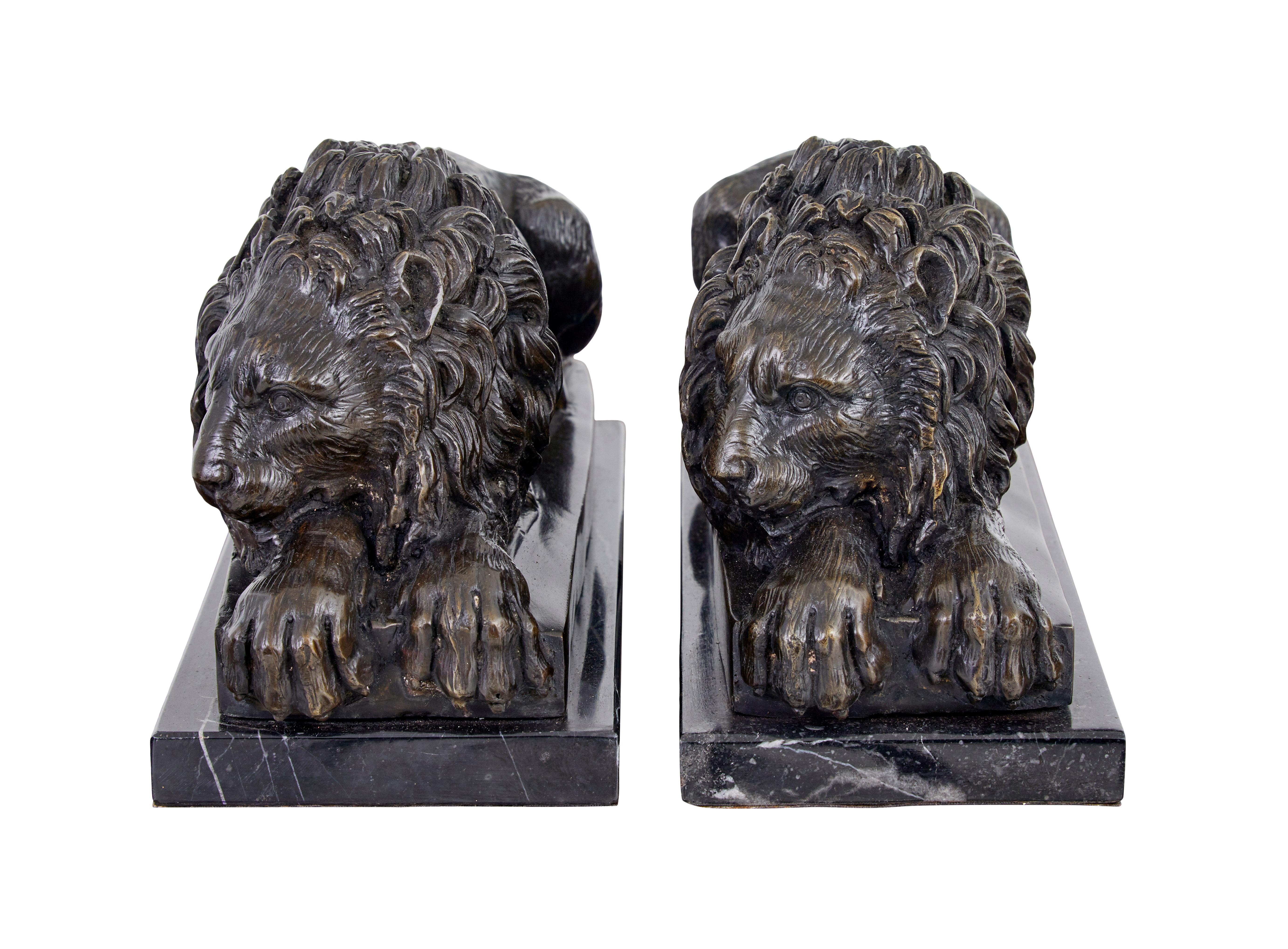 Pair of bronze and marble lion book ends.

Good quality reproduction of crouching bronze lions, mounted on black/grey marble plinths.

Ideal for keeping books upright or for other decorative uses.

Rich colour.