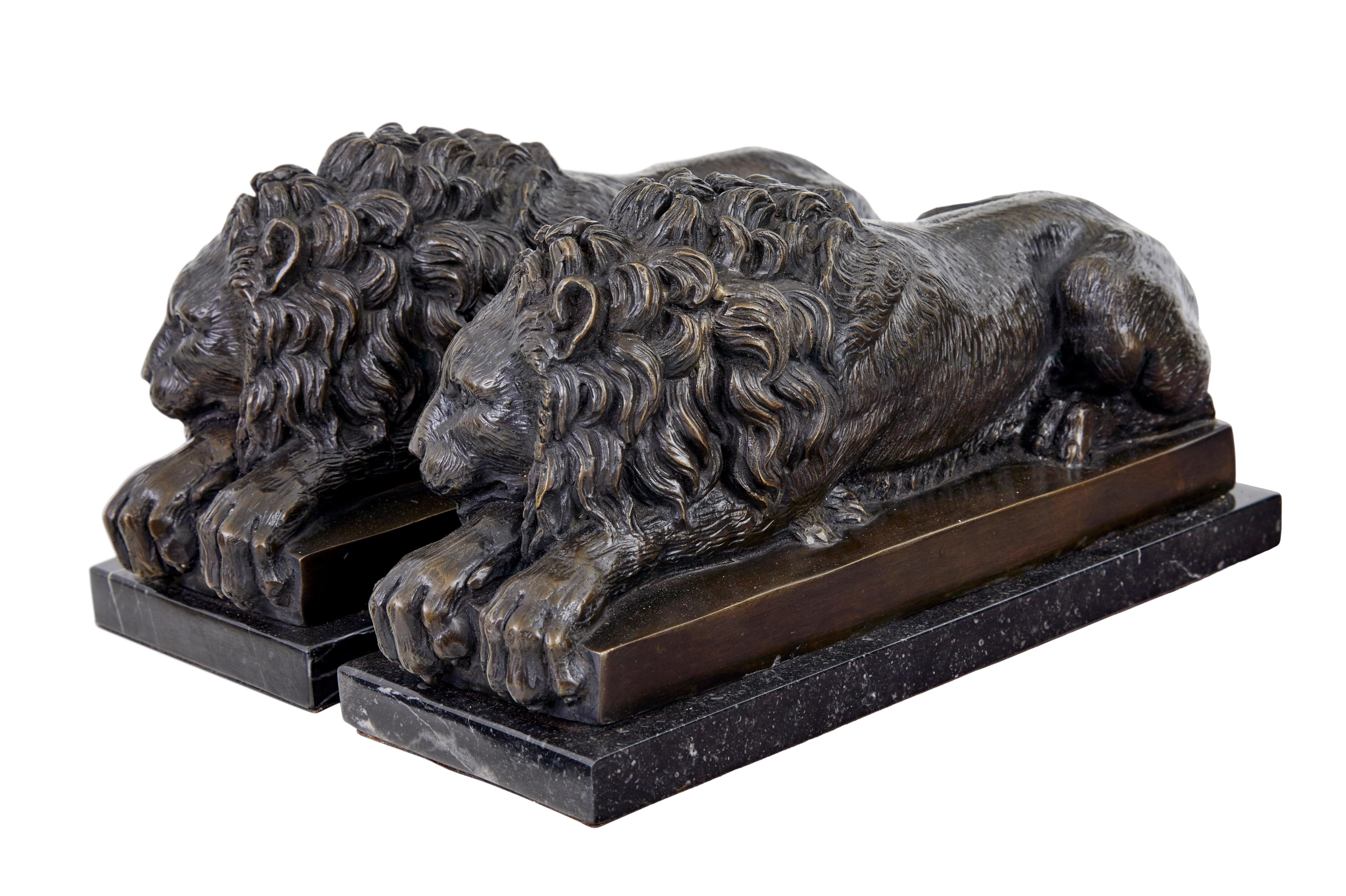 Grand Tour Pair of bronze and marble lion book ends