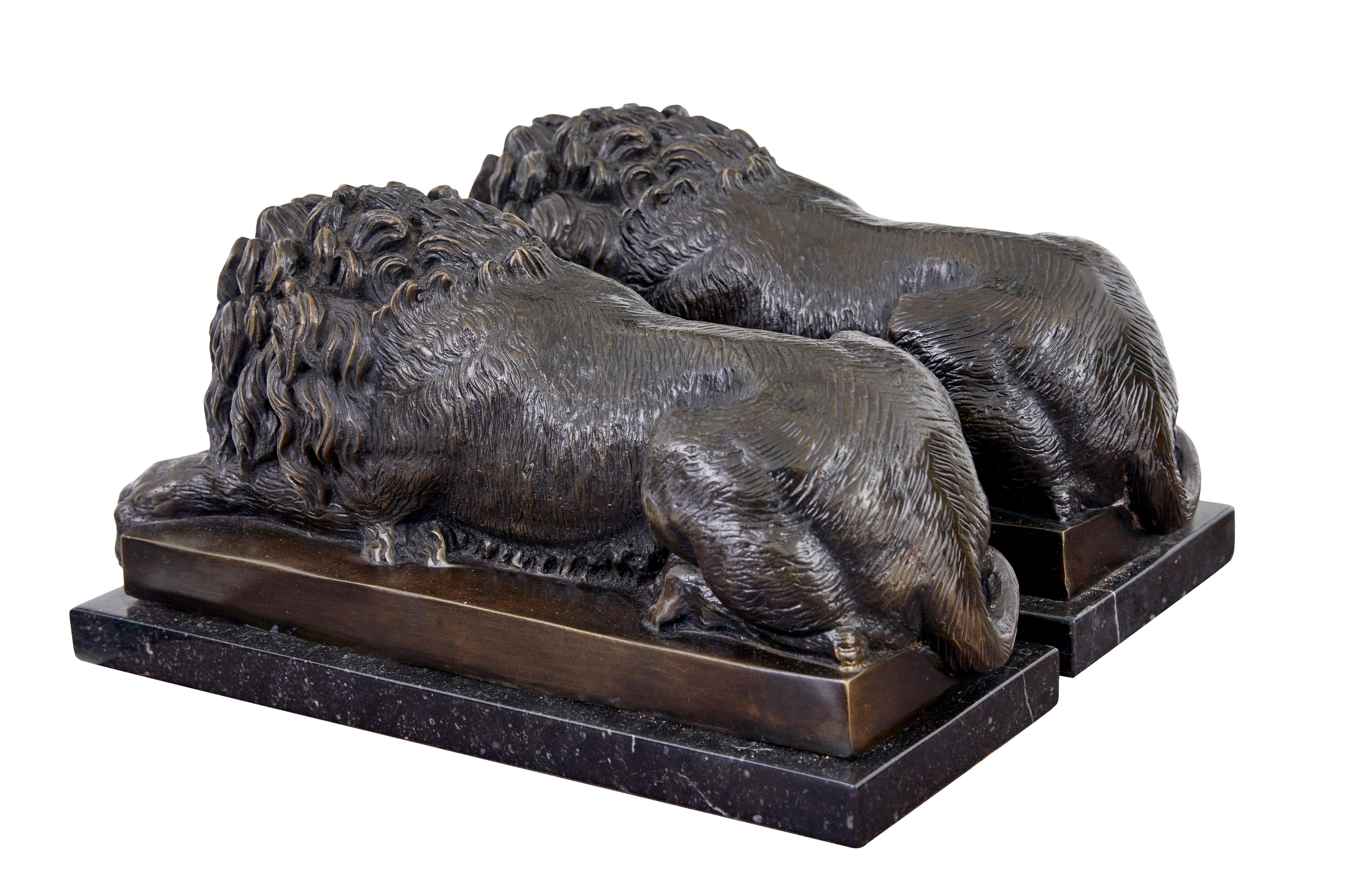 English Pair of bronze and marble lion book ends