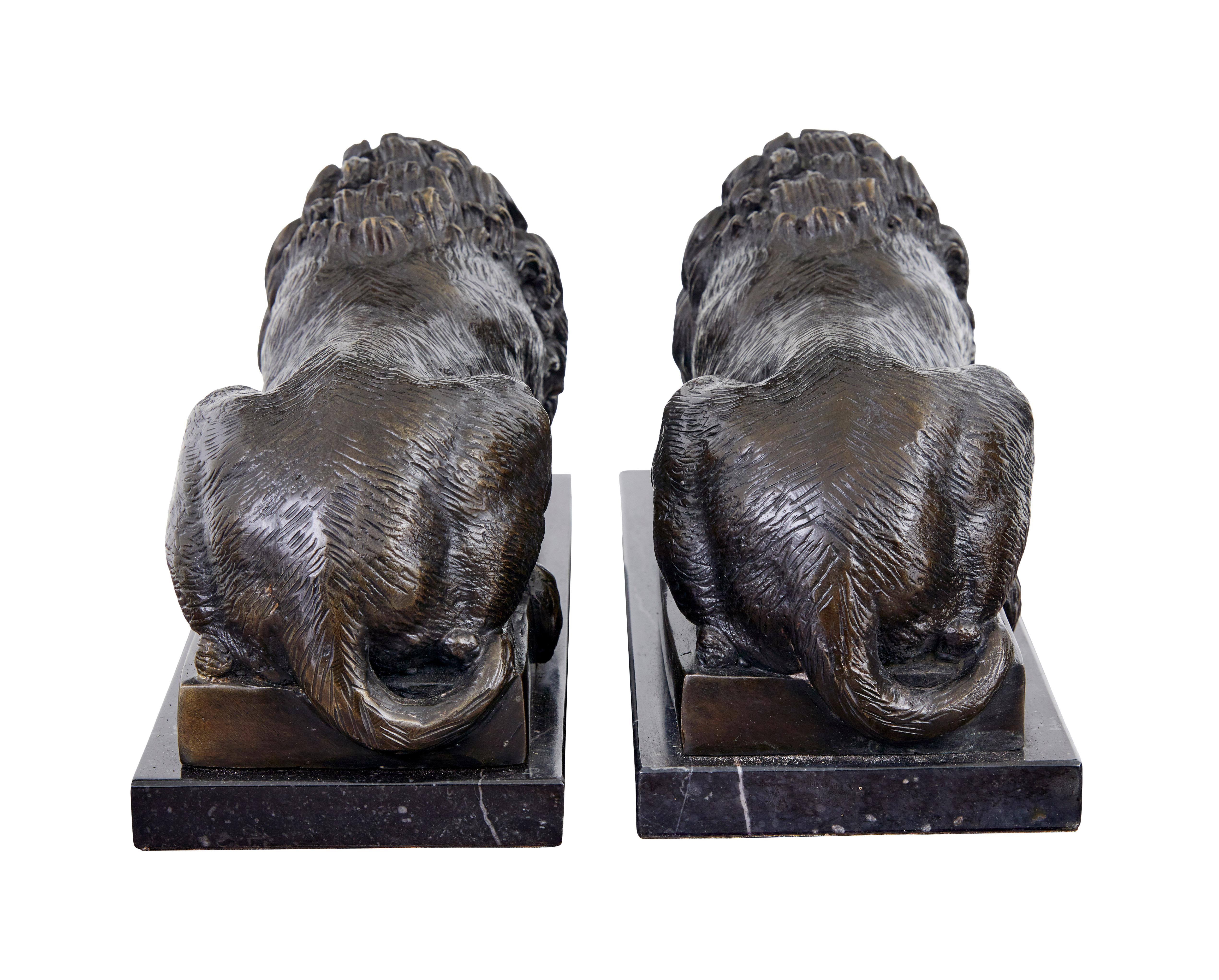 Cast Pair of bronze and marble lion book ends