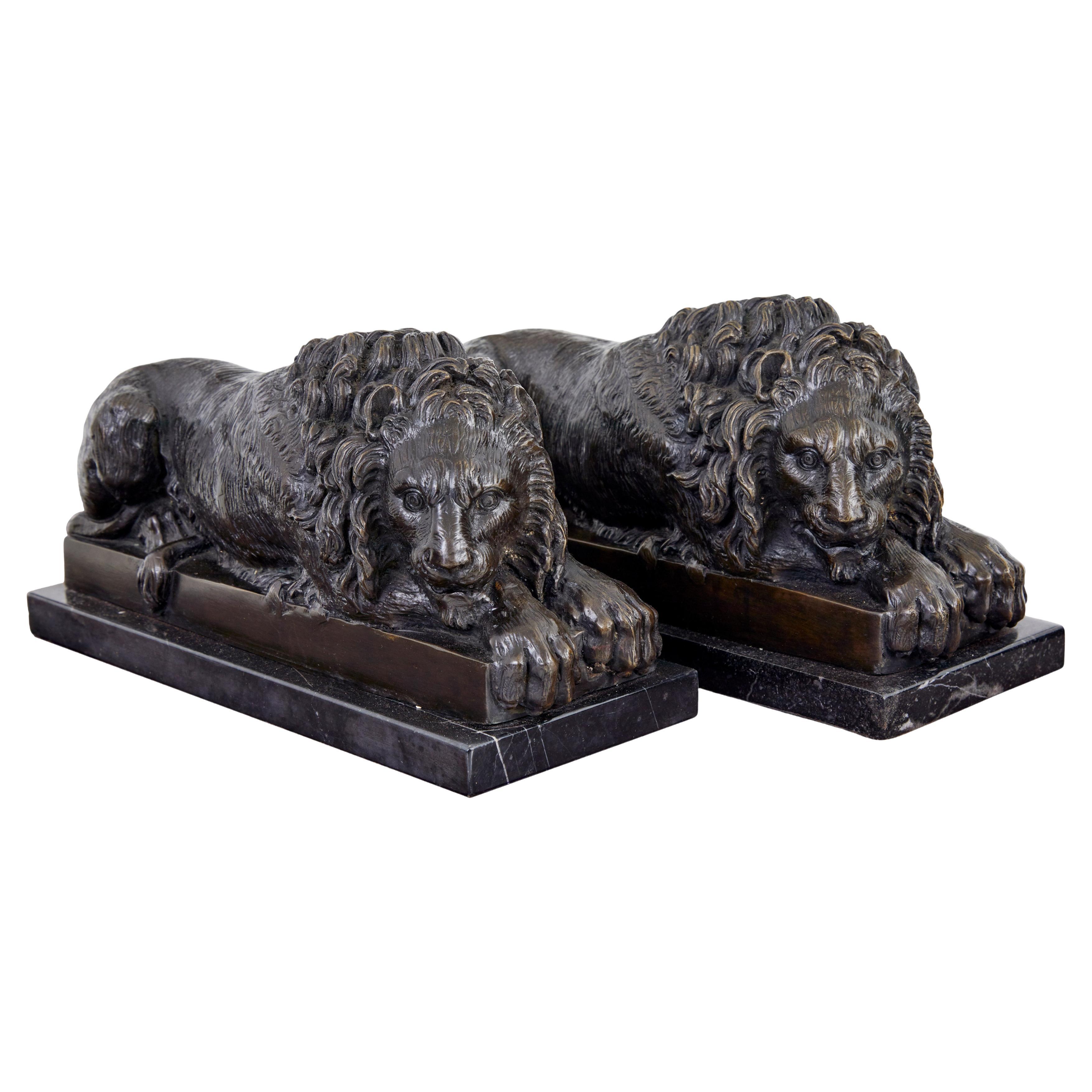 Pair of bronze and marble lion book ends
