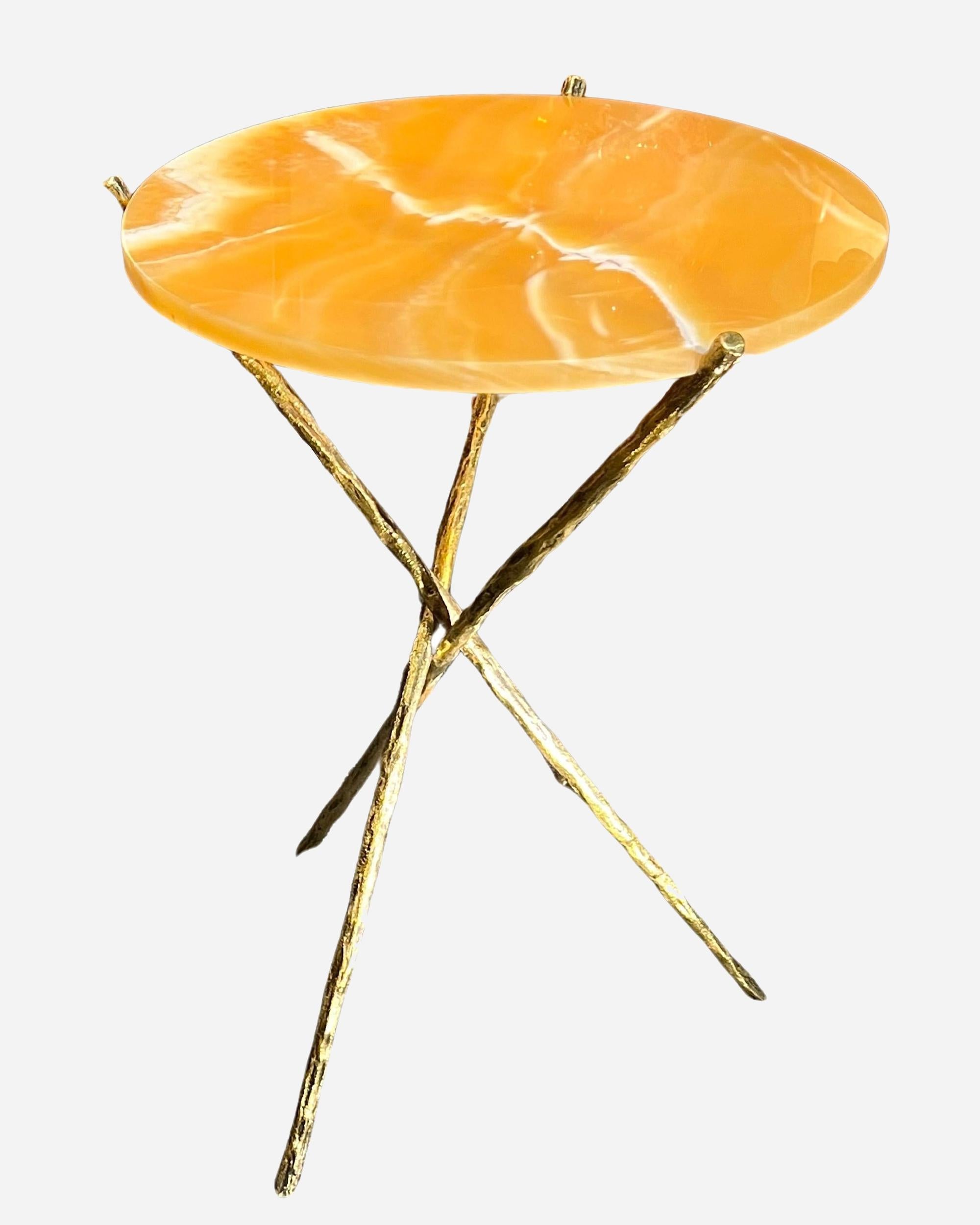 Nice pair of high pedestal tables, bronze tripod base in imitation of three crossed tree branches, round yellow onyx trays.

Limited edition.
Height : 75,5 cm (29.7 inches)
Diameter: 56,5 cm (22. 2 inches)
Trays height: 74,5 cm (29.3 inches)
Trays