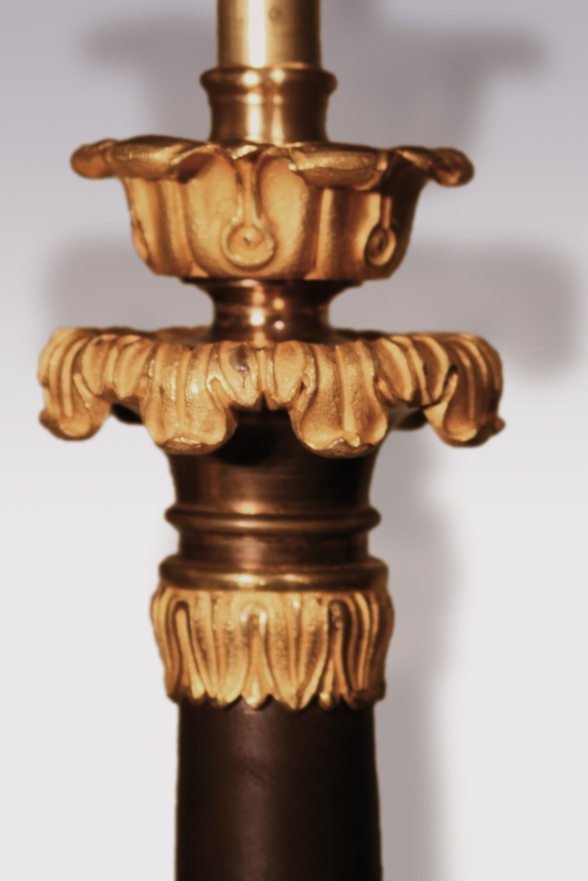 Regency Pair of Bronze and Ormolu Triform Candlestick Lamps For Sale