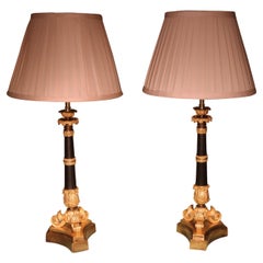 Pair of Bronze and Ormolu Triform Candlestick Lamps