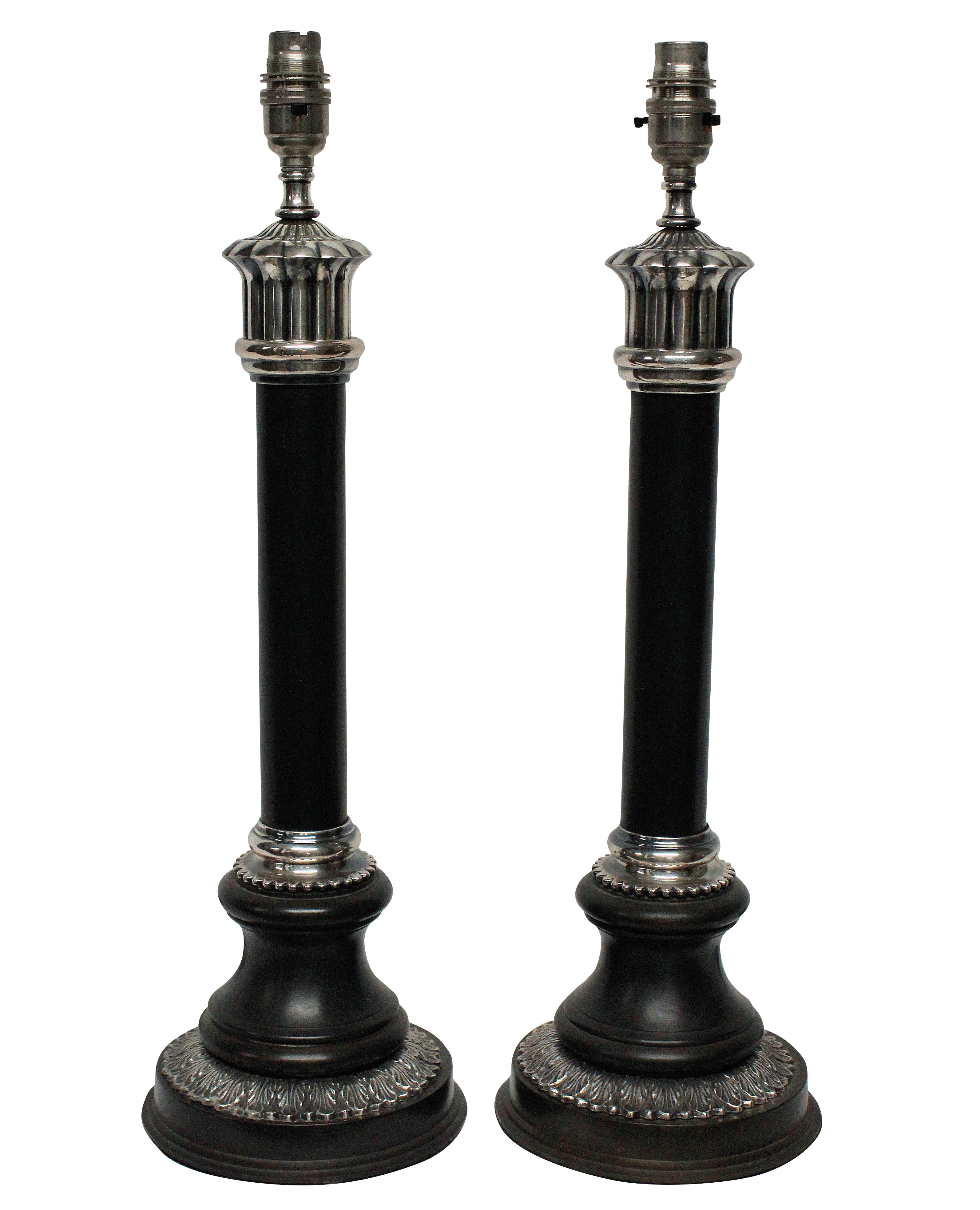 A pair of English bronzed and silver plated neoclassical column table lamps.