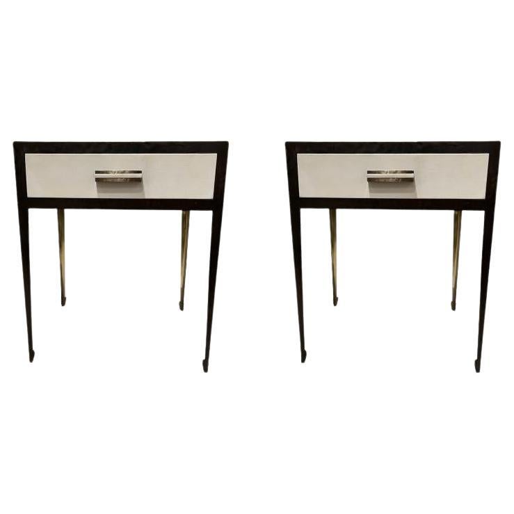 Pair of bronze and steel bedside tables with parchment panels