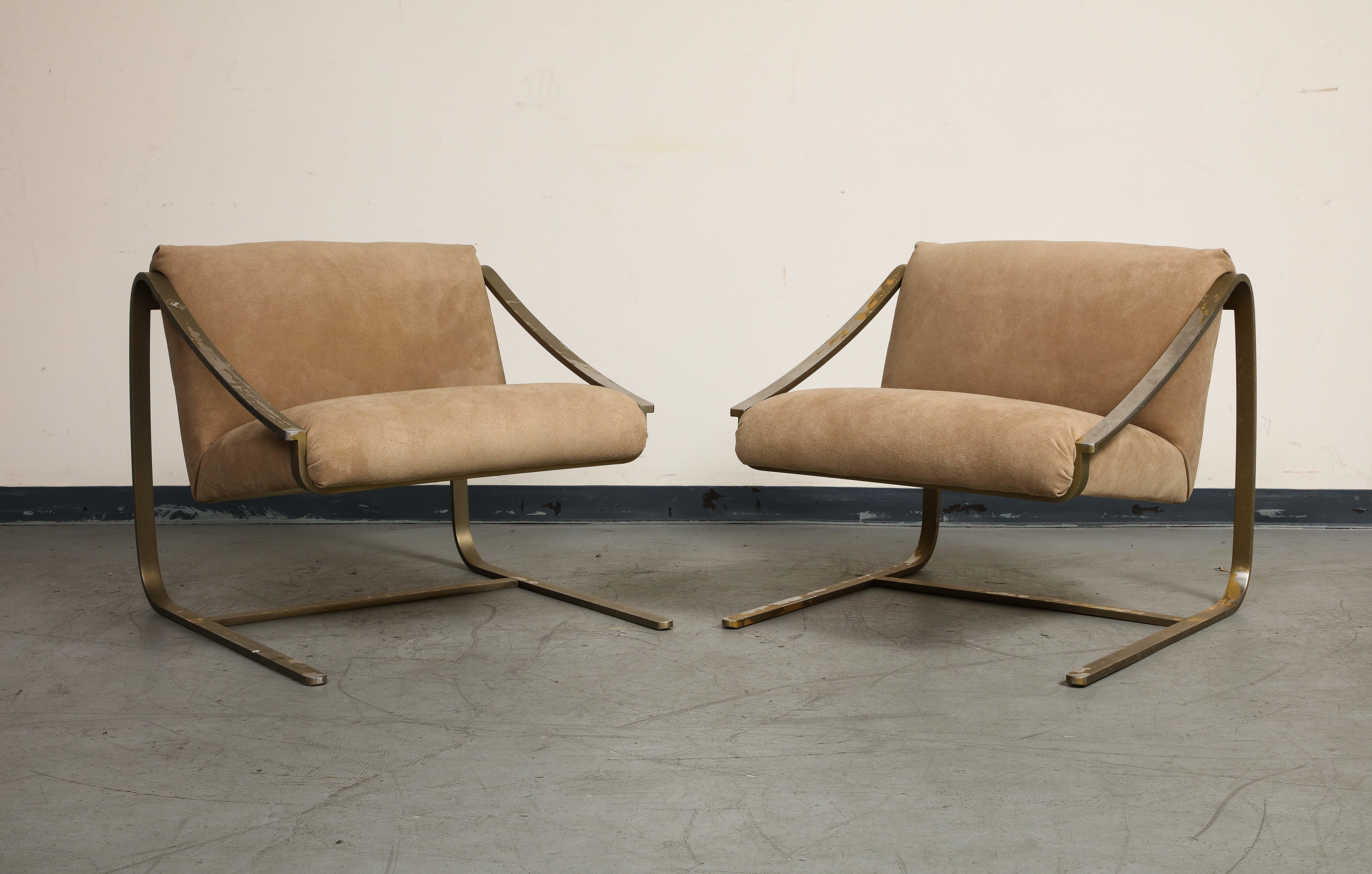 A pair of minimal Modernist lounge chairs, with bronze frames and newly upholstered in Schumacher 