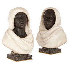 Pair of Bronze and White Marble Busts of a North African Man and Woman