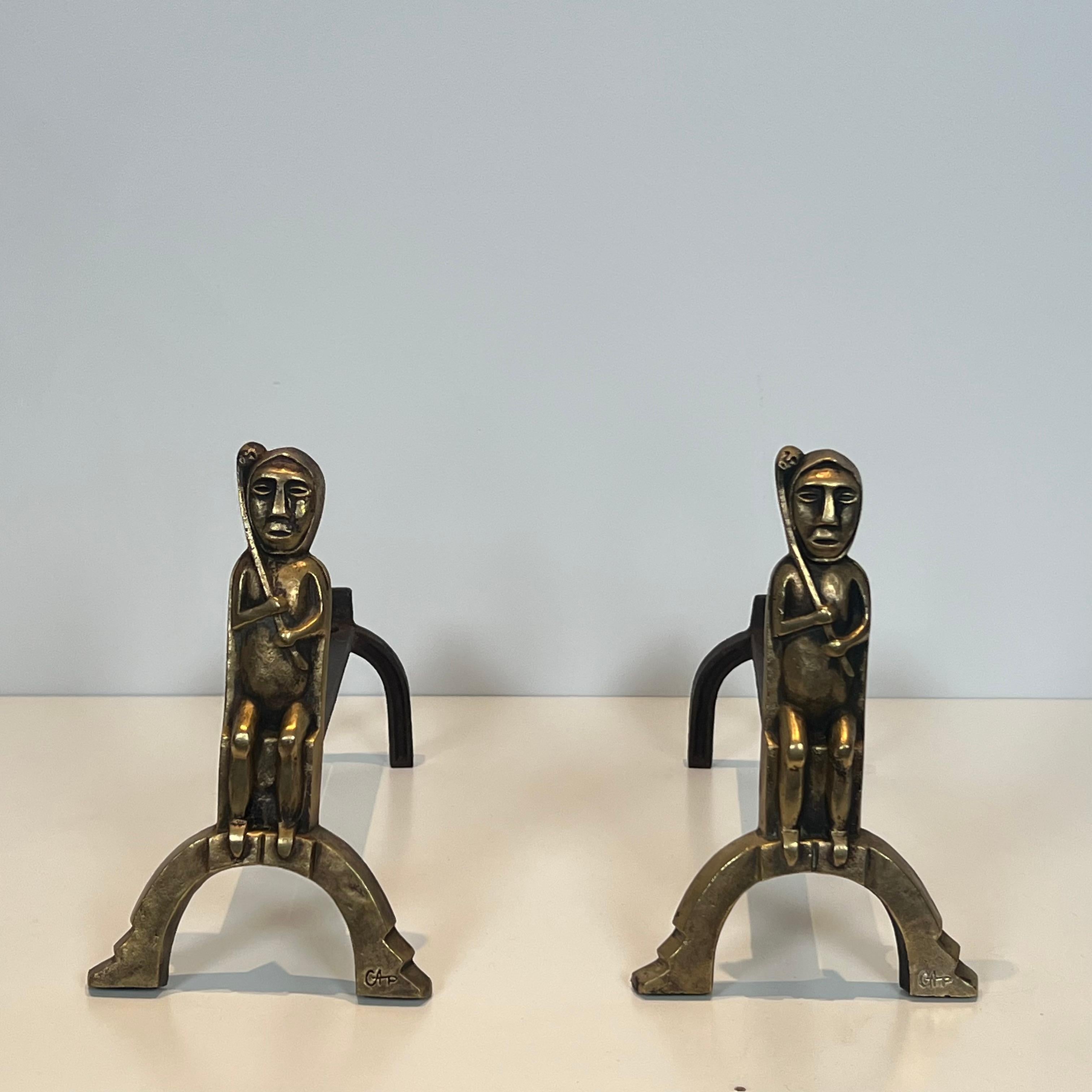 This nice and interesting pair of andirons with seated shamans is made of bronze. This is a French work monogrammed by Anton Prinner. Circa 1930
