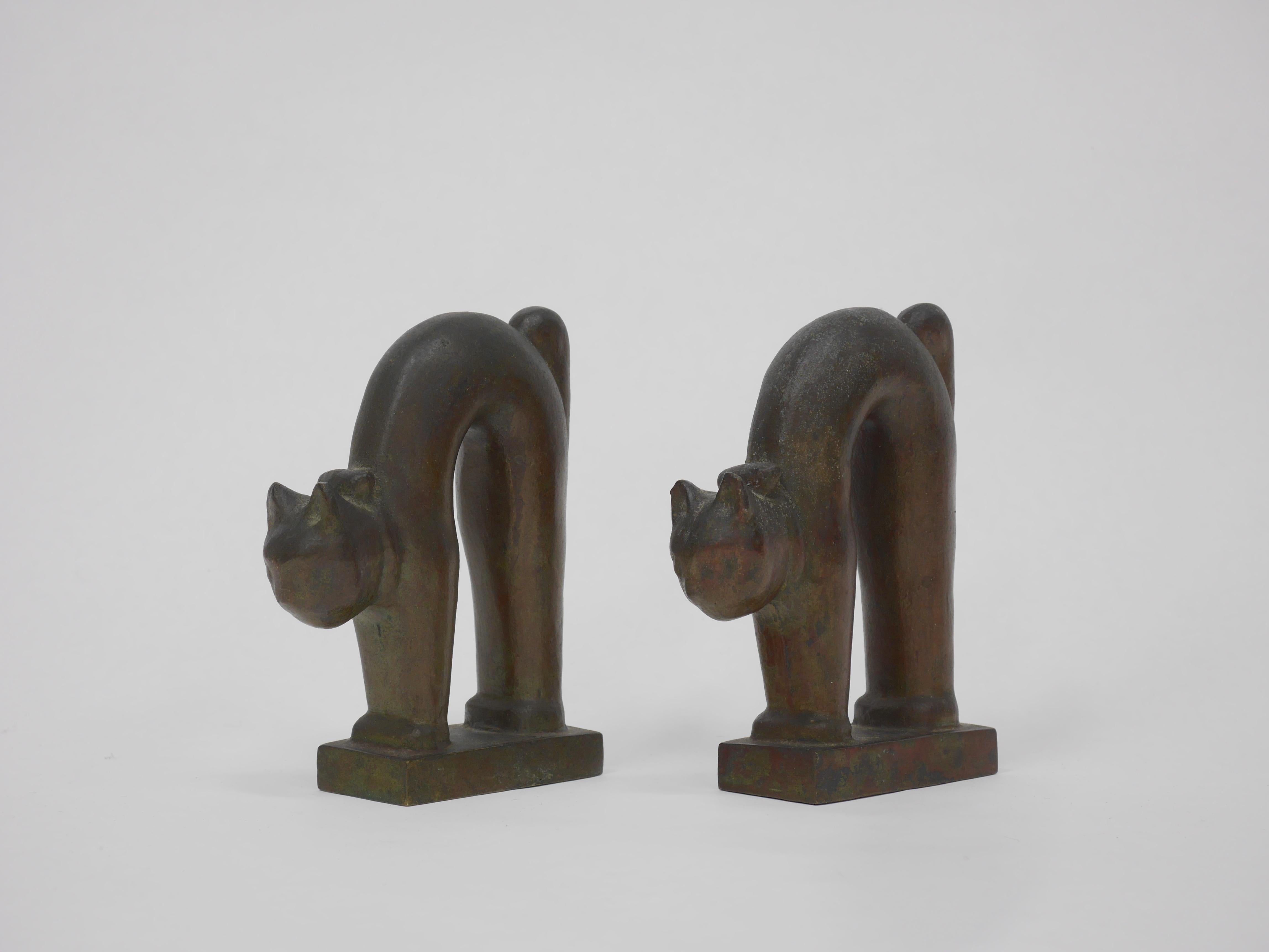 Art Deco patinated bronze stretching cat bookends.