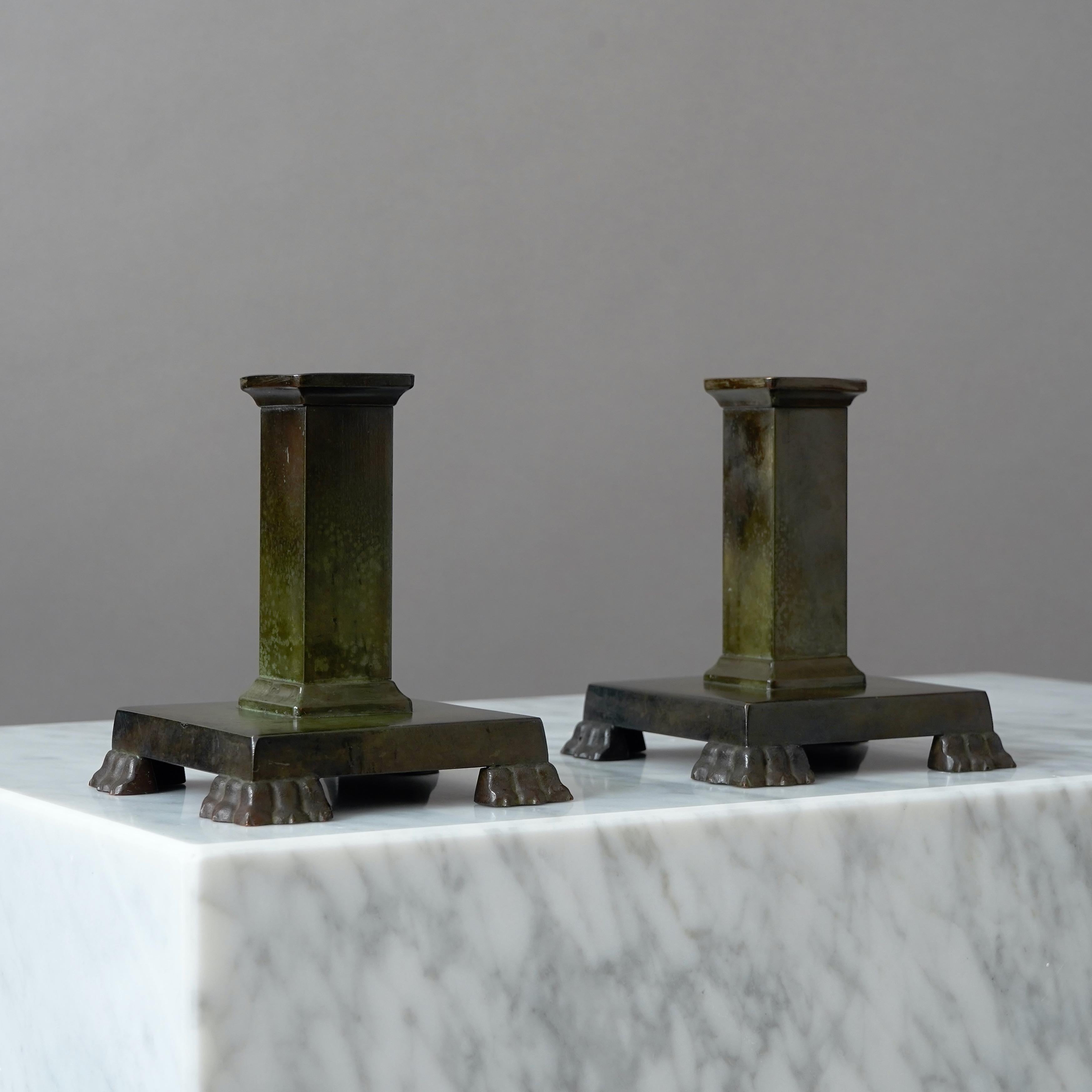 Pair of Swedish Grace bronze candlesticks with amazing patina. 
Made by GAB Guldsmedsaktiebolaget, Sweden, 1930s.  

Great condition, only a few light scratches.
Stamped 'BRONS' and makers mark.