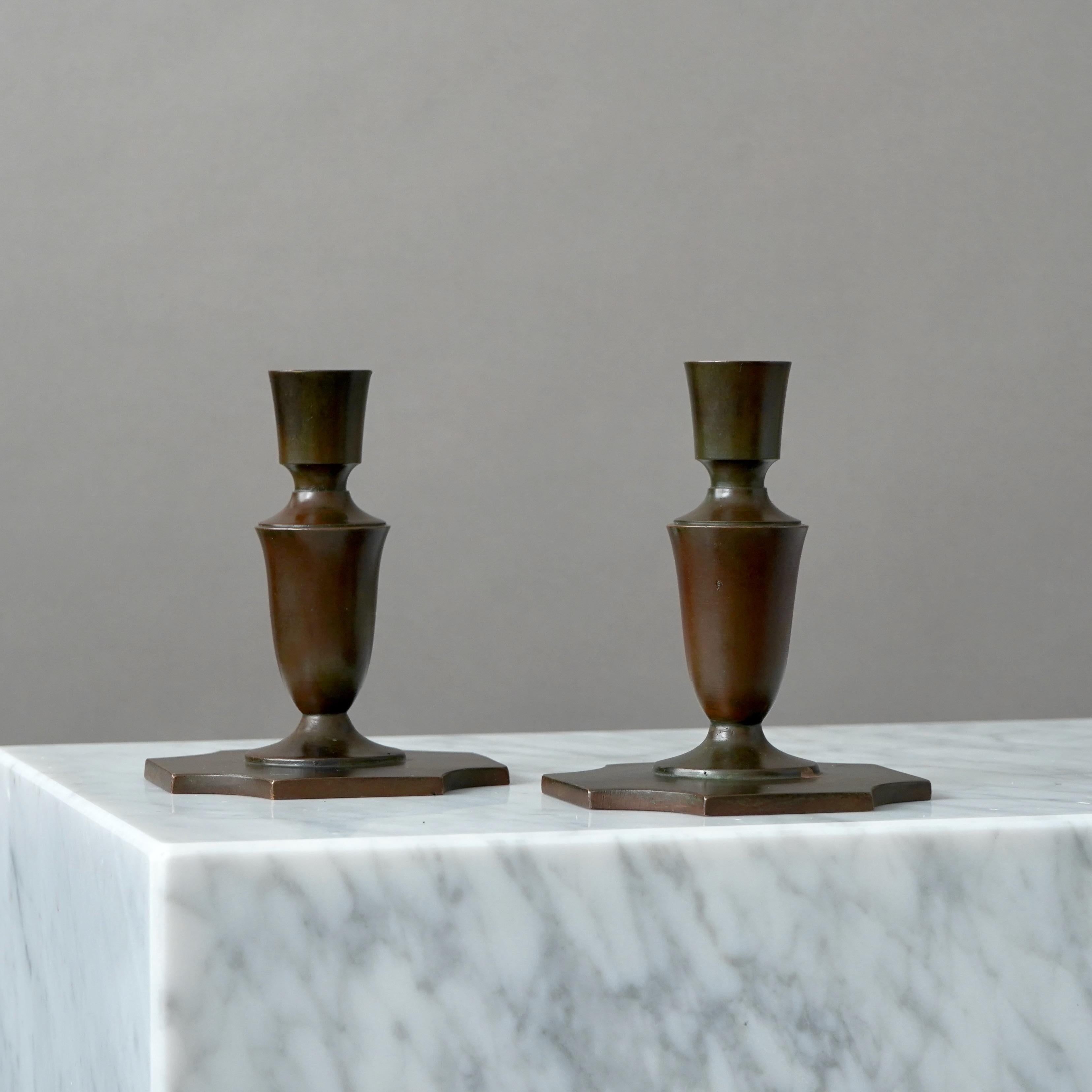 Pair of Art Deco / Swedish Grace bronze candlesticks with amazing patina. 
Made by GAB Guldsmedsaktiebolaget, Sweden, 1930s.  

Great condition, some wear to the patination and some light scratches.
Stamped 'BRONS' and makers mark.