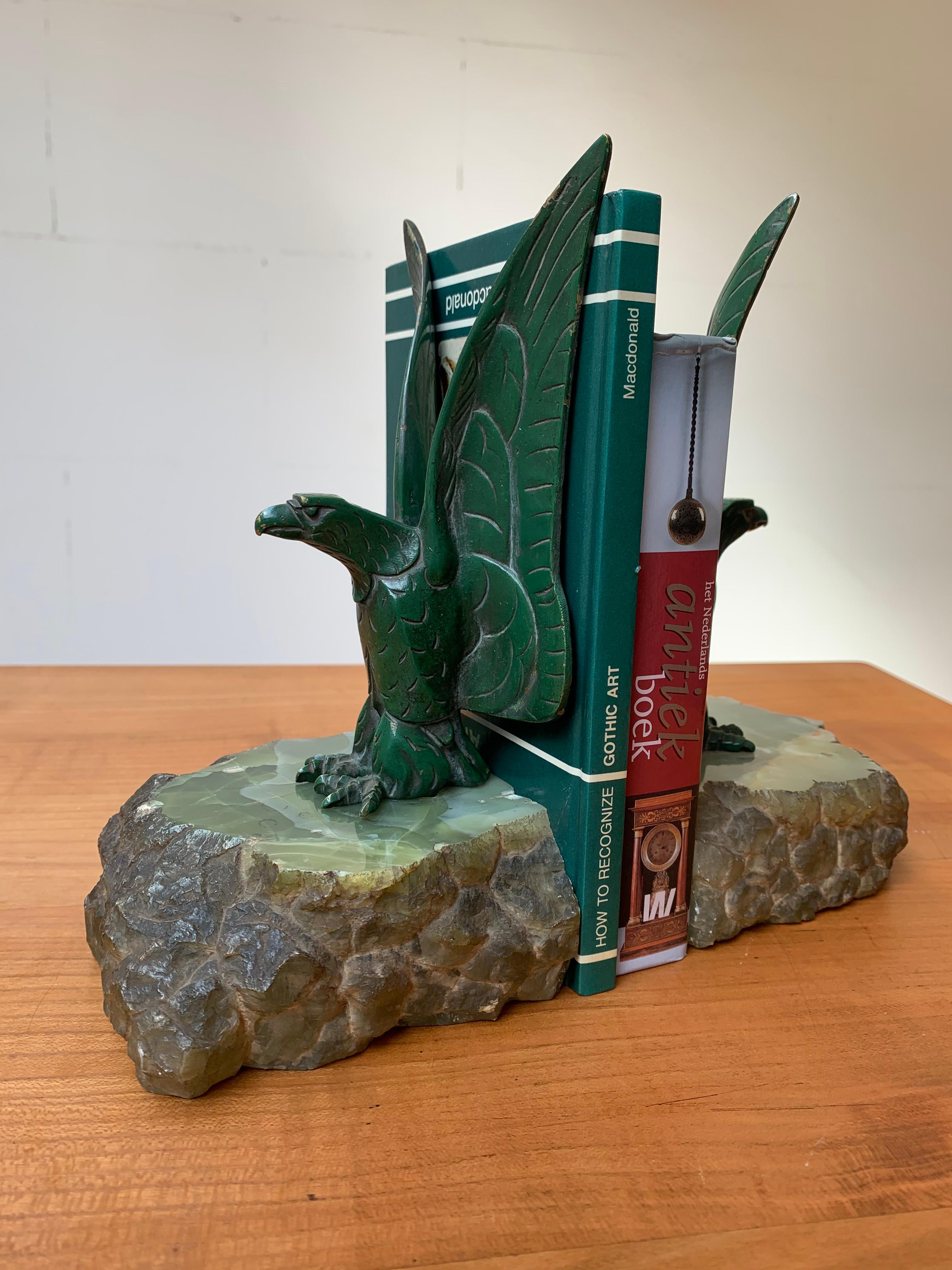 Original green painted, solid bronze and open wings eagle bookends on onyx base, circa 1920.

If eagles have a special meaning to you or to one of your loved ones then this unique pair could be the perfect gift. These beautifully stylised, Art Deco