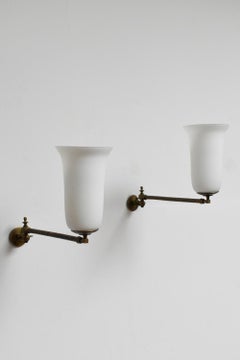 Antique Pair of bronze articulated oil wall lamps, XIXth c.