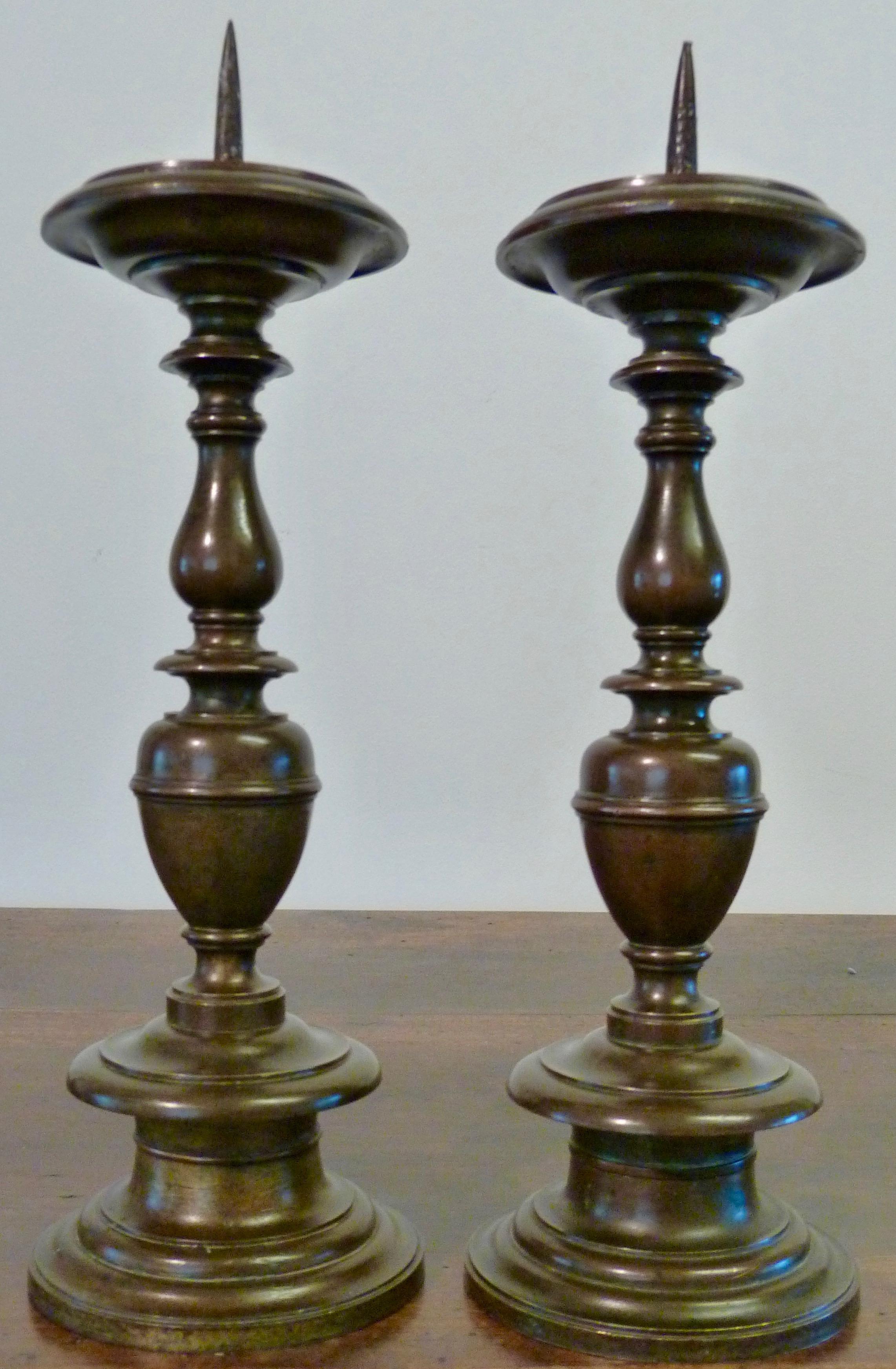 Italian Baroque, Pair of Bronze Pricket Candlesticks, 17th Century

With a turn baluster stem and vase on a circular base and molded dish.
 